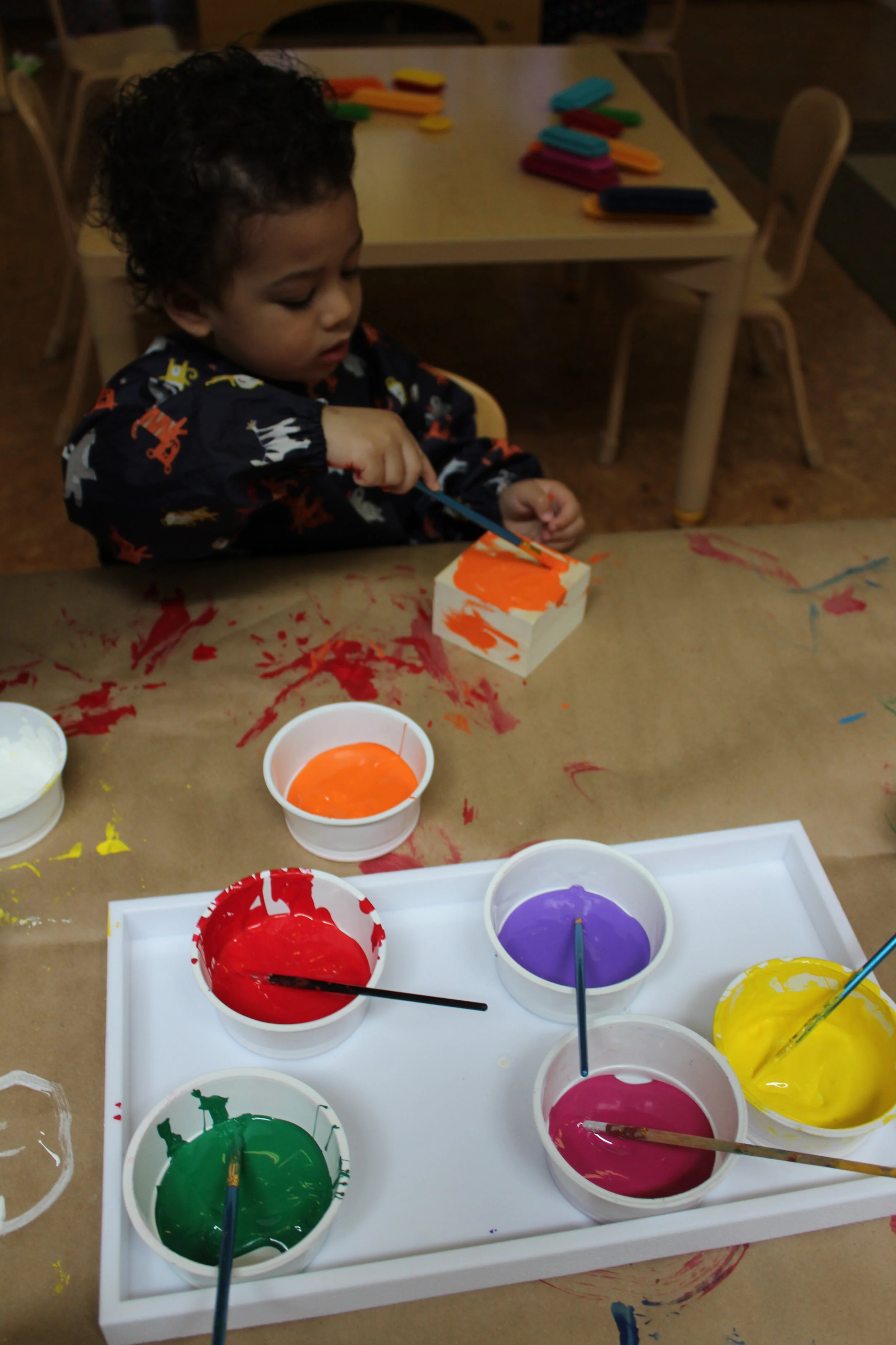  The children are collaborating in the Art Fair by painting boxes and creating a painting, using pom poms.&nbsp;   