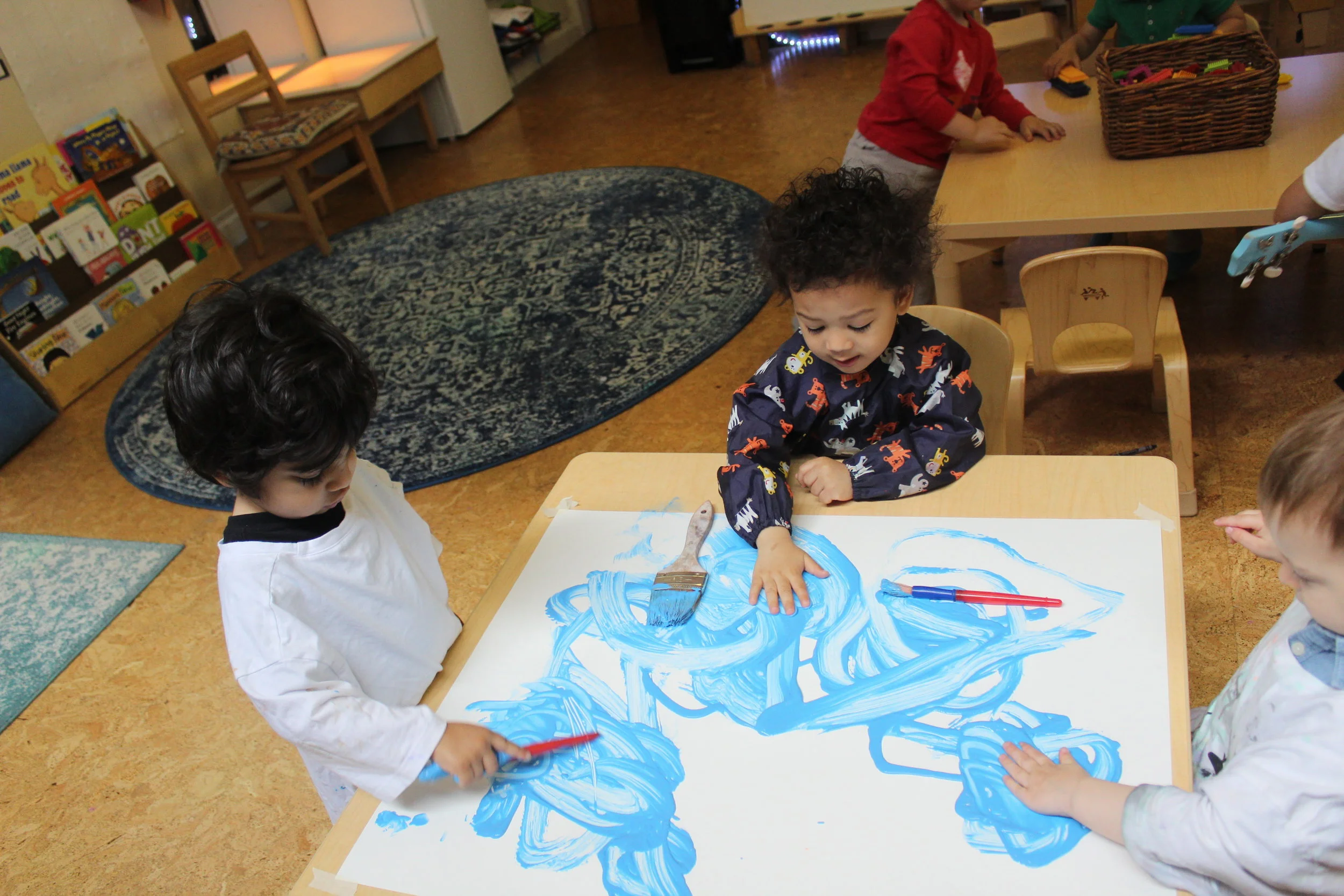  Painting with the color blue and yellow and shaving cream!  As the children mixed both colors they created a secondary color, green!  