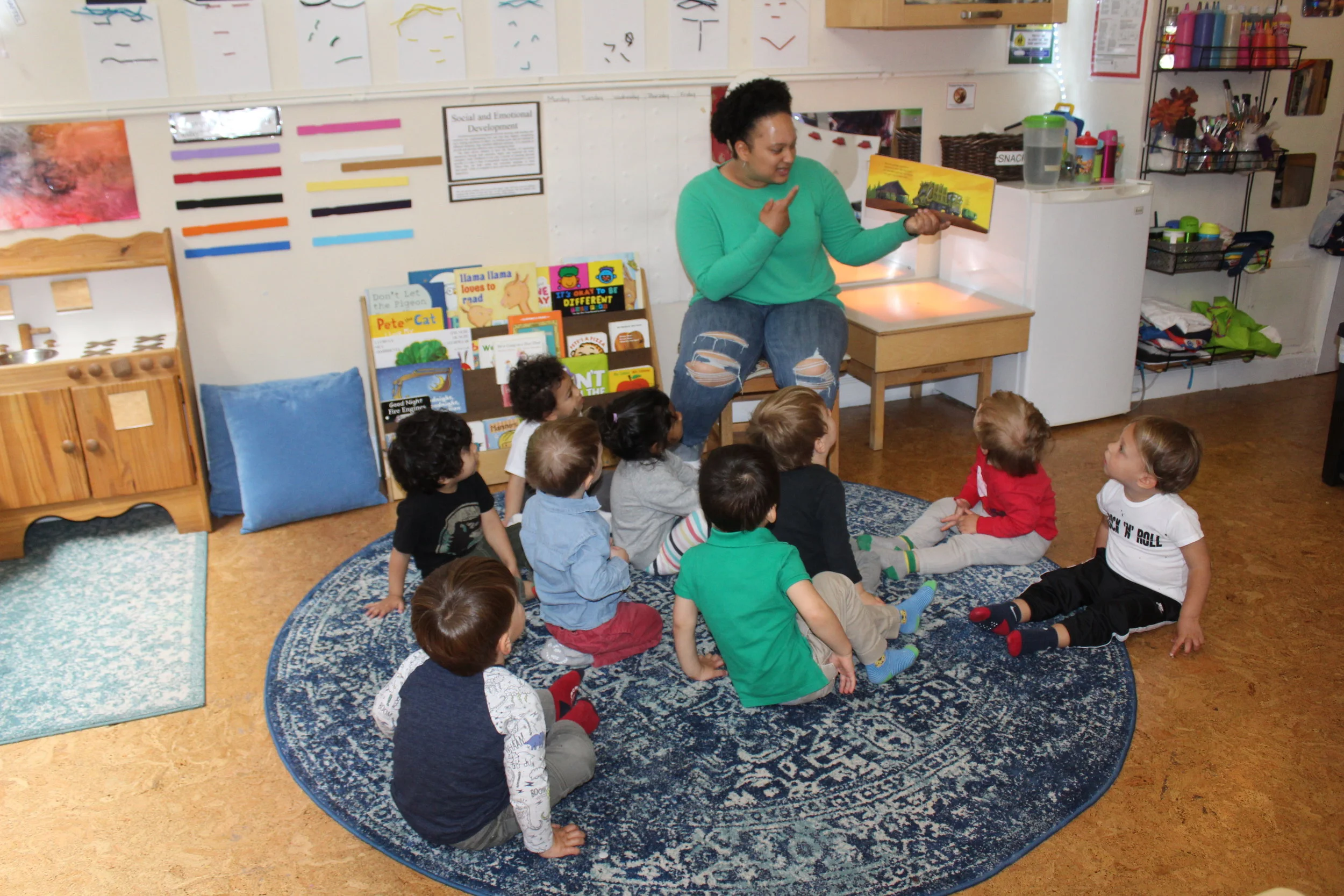  Nate’s mom, Melissa, came to visit and read to the children. The children listened as Melissa reads one of their favorite books.&nbsp; &nbsp;   