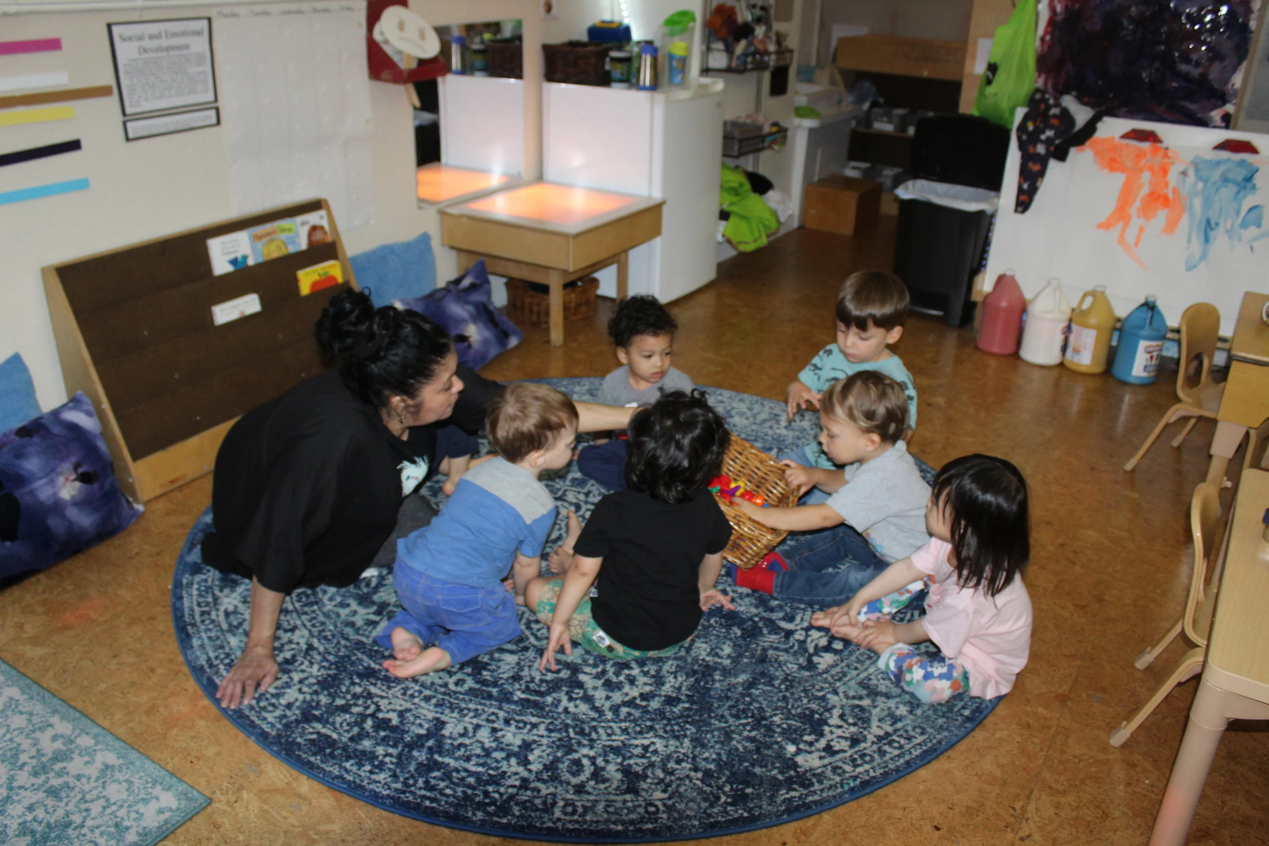  The children have learned many colors through different interactions and activities. The objective was to select an orange peg from the basket, and then the child who picked the color will place them in the Ziploc bag.&nbsp; The children are familia
