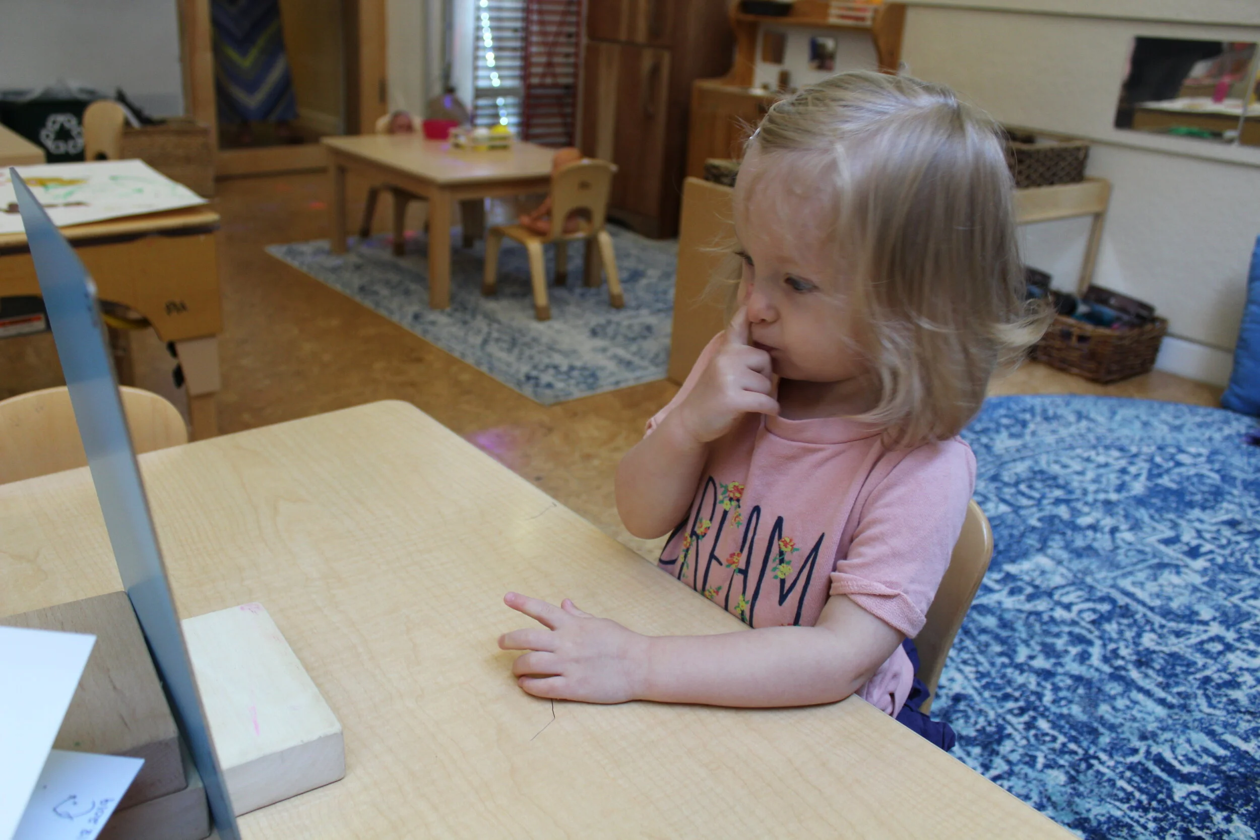  Teagan pointed to her nose, hair, and mouth. 