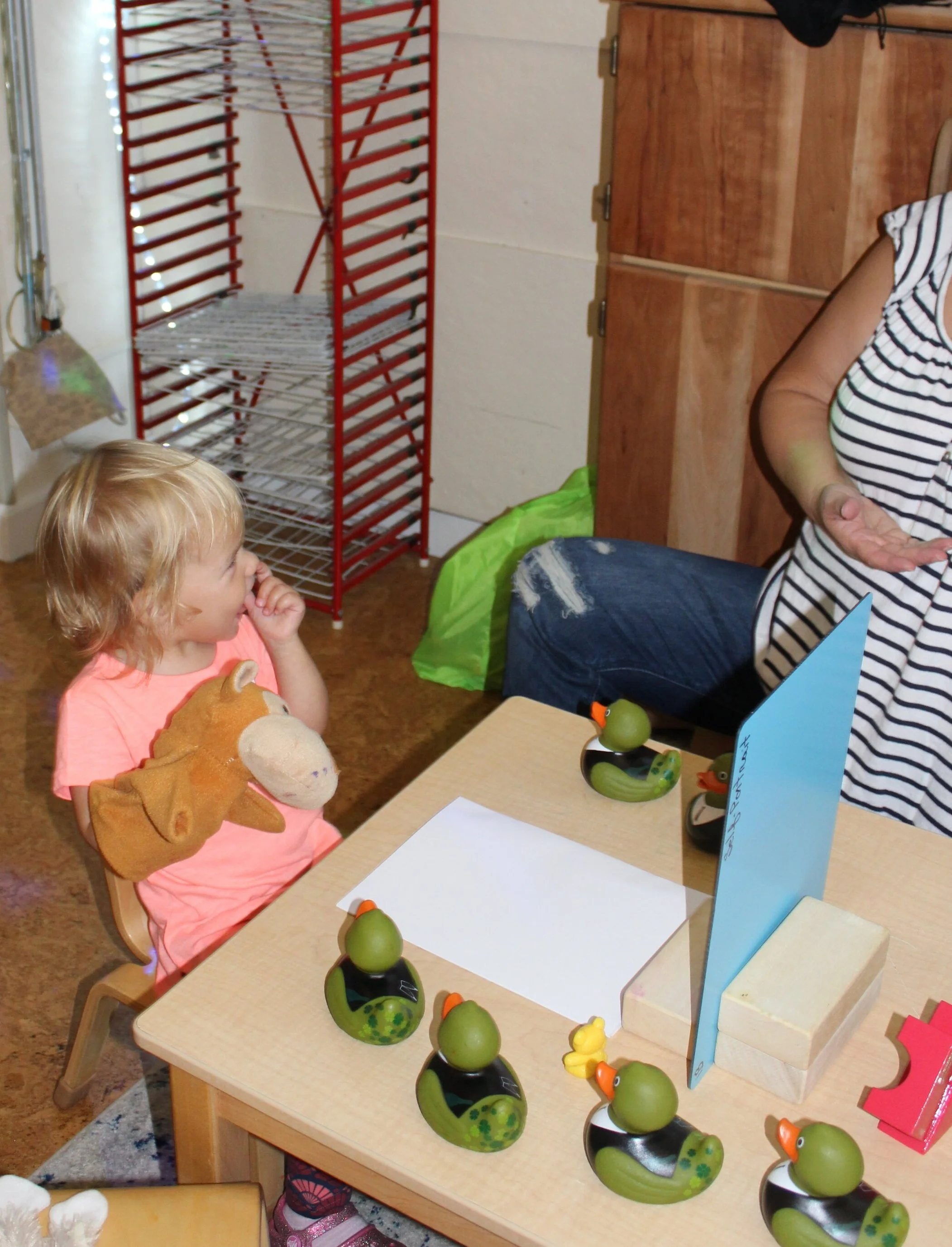  Alexandra appeared excited as she pointed to her nose and teeth. 