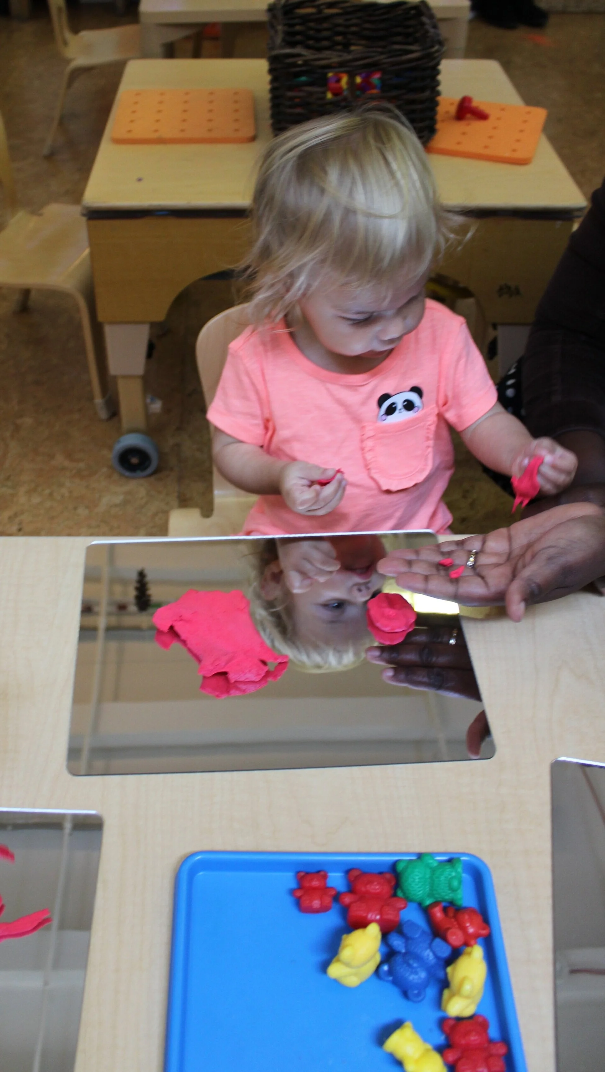  It's a lightweight, spongy modeling material that sticks to itself, but not their hands. Alexandra seems to enjoy manipulating and exploring it by pulling small pieces and sharing them with Ines. 