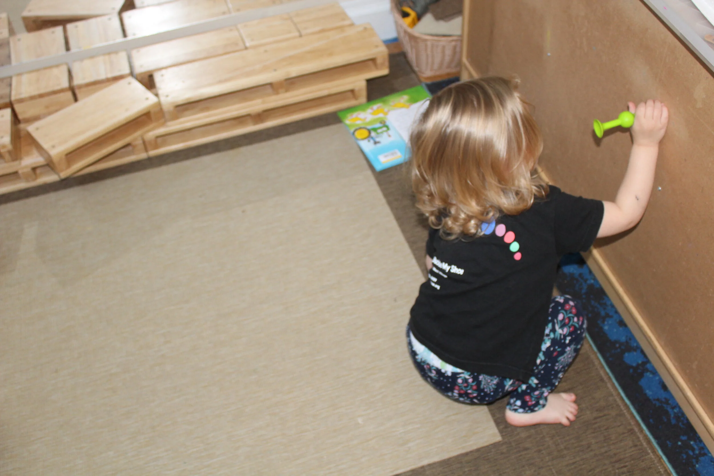  Teagan attempted different surfaces to build a wiggly creation. These suction-cup building pieces encourage fine motor skills, spatial reasoning, creativity, exploration, and experimentation. She was very persistent in finding a place in which she c