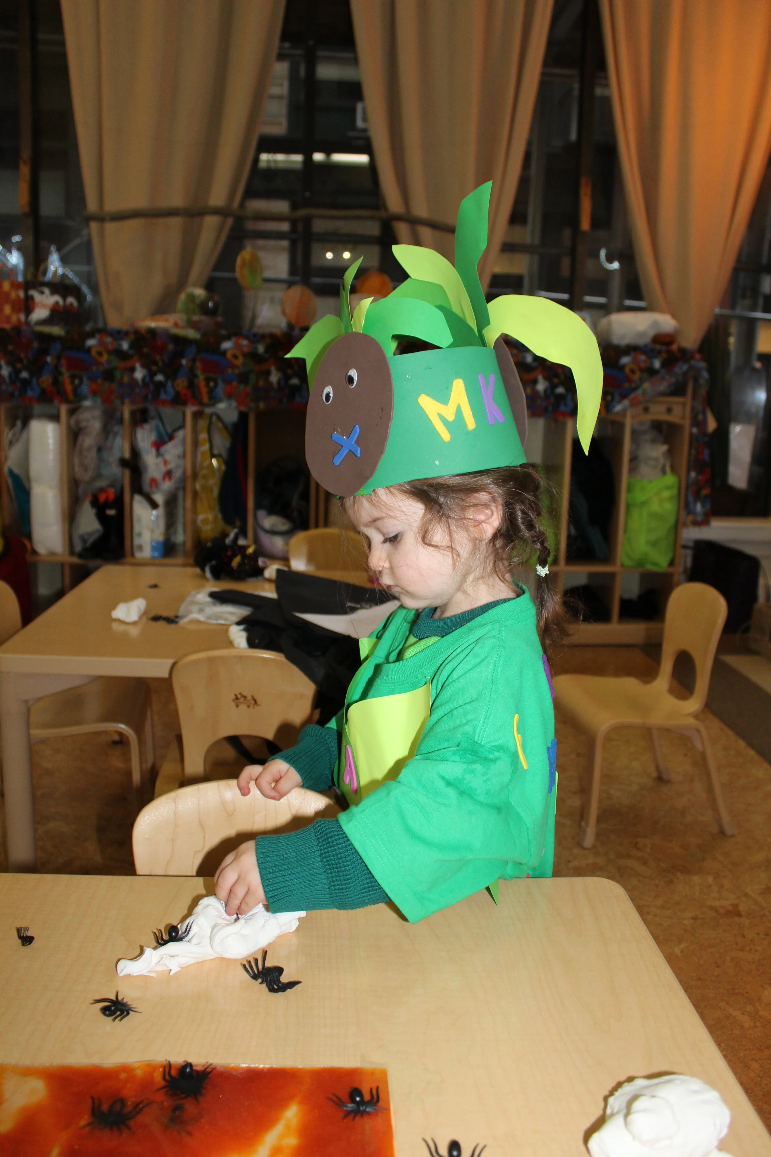  Model magic is a spongy and lightweight material. Children can shape the model magic as they squeeze it with their hands and fingers. Some of the children adorned the model magic with black spiders. 