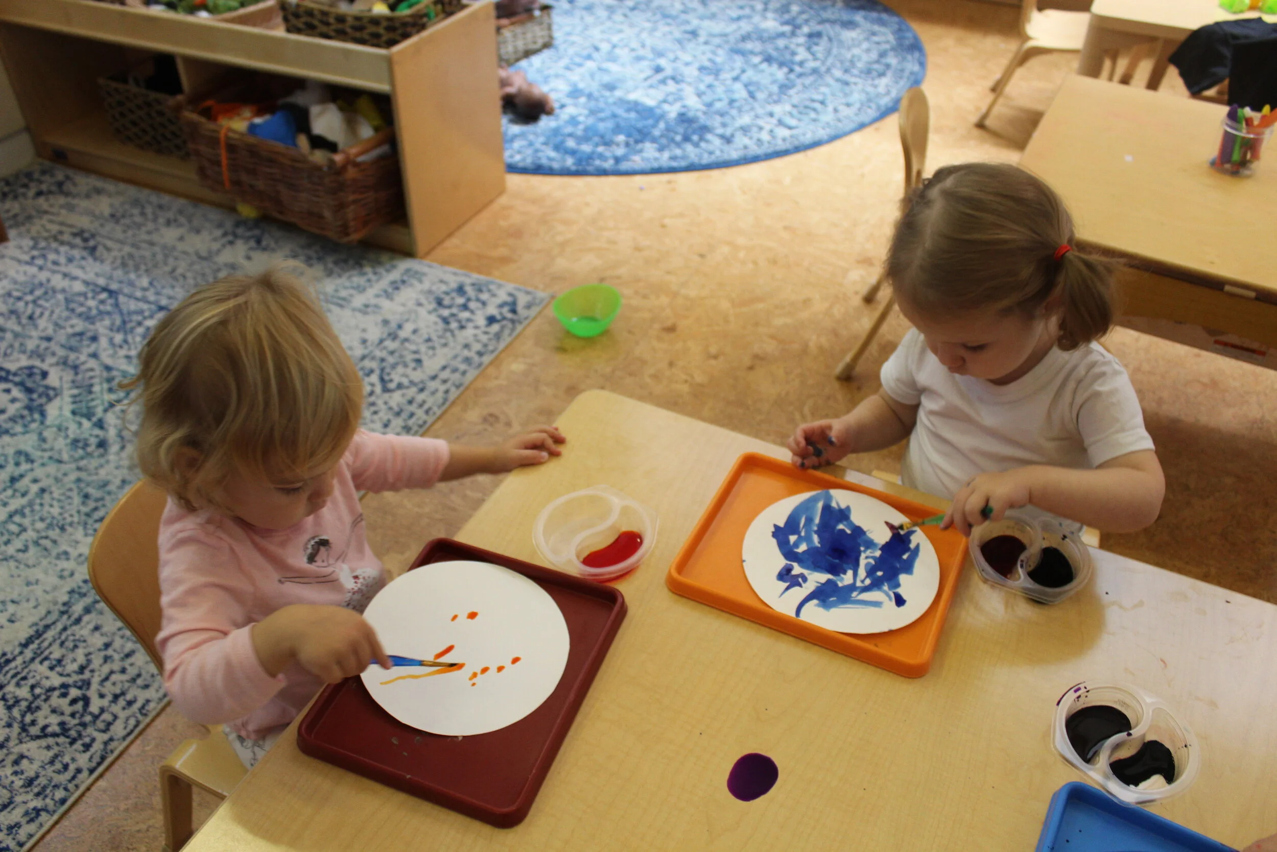  Exploring on cardstock paper provides young toddlers with new ways to explore watercolor. Exploring different mediums enhances their knowledge and new ways of investigating art tools. 