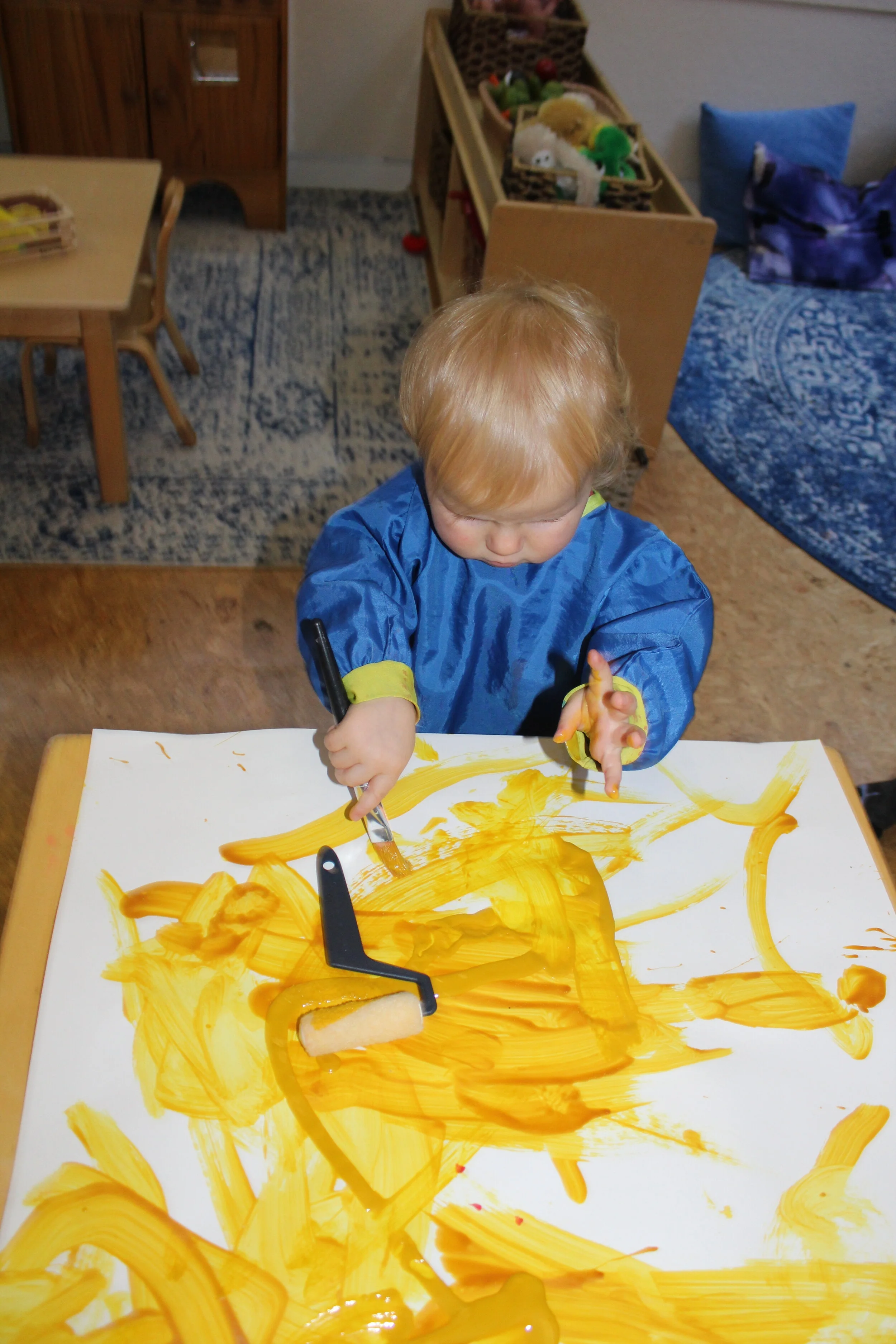  Blake from 1A joined us during the week. She seemed to enjoy exploring with her hands and fingers. Paint is a rich sensory experience. There are no cut out shapes or pictures to paint, no predetermined final product, and children can choose the tool