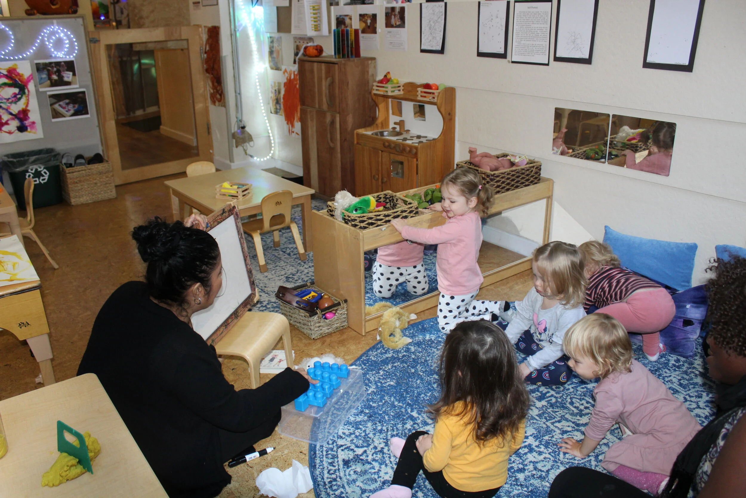  Circle time entails singing songs, reading stories, and introducing activities. We counted blue Lego Blocks together in English and Spanish. We also wrote the numerical number five on the erasable board. We do not want them to memorize but to have a