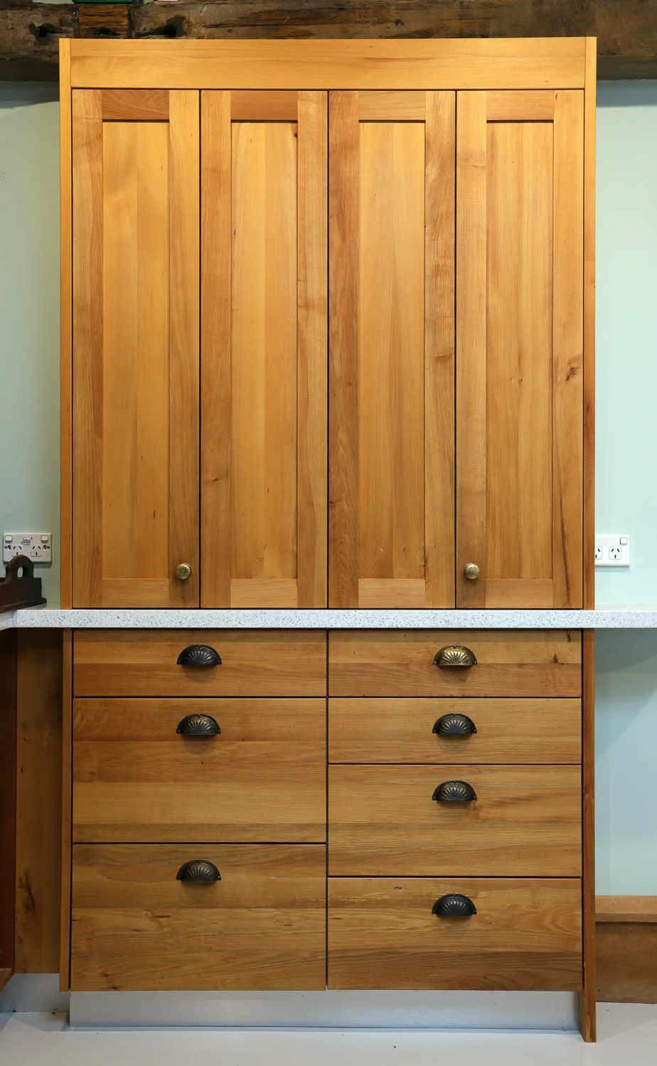 An on-bench pantry made from milled native timber found on a beach