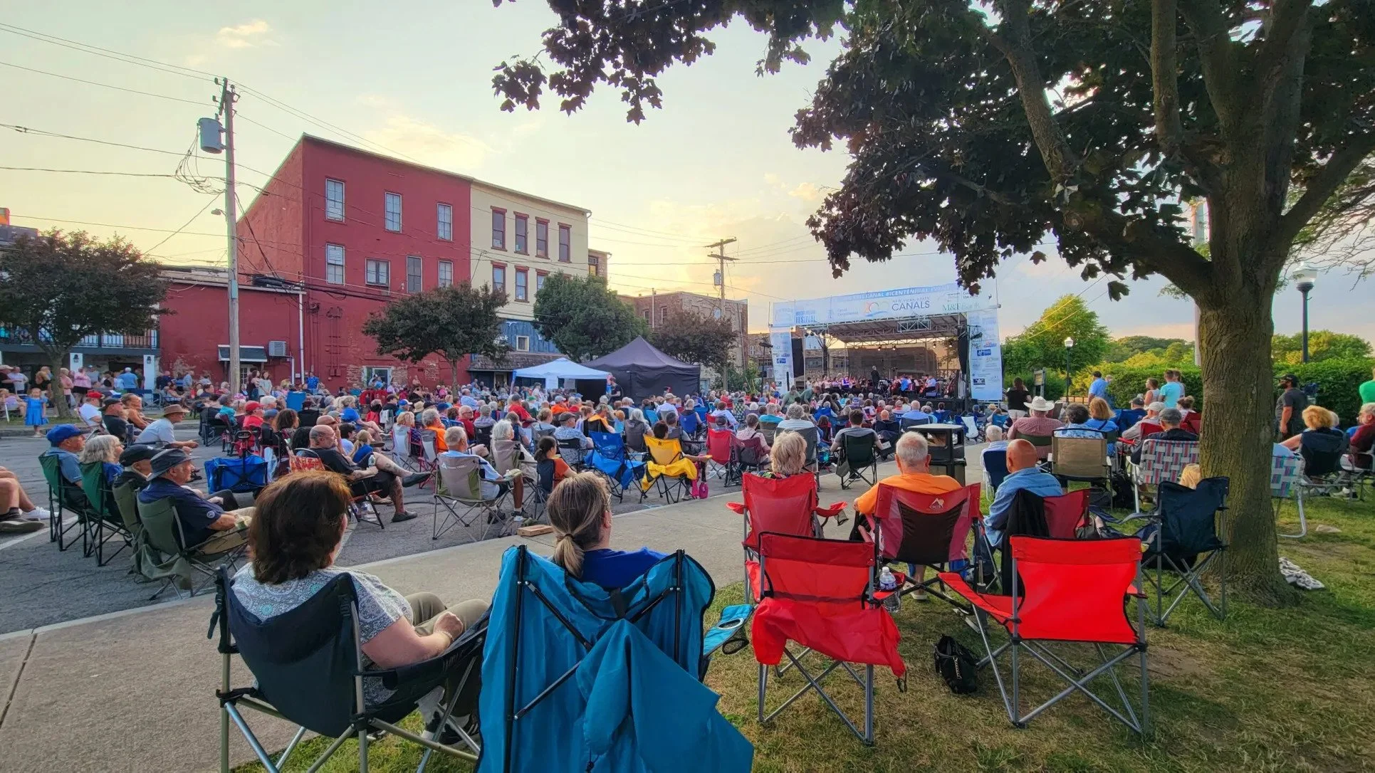 Water Music NY attendees enjoying a free concert along the Erie Canal Medina, NY | July 2, 2025
