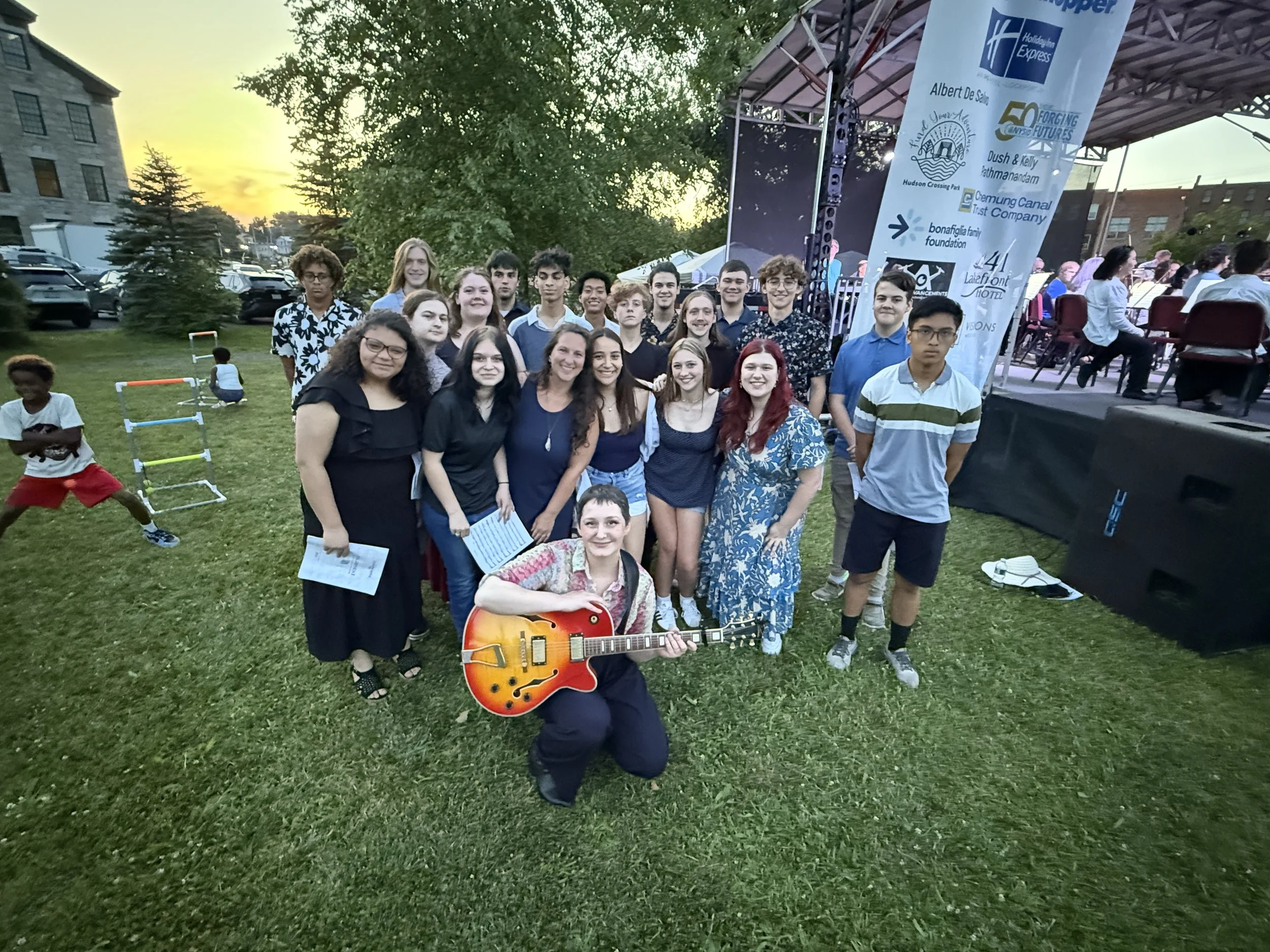 Tanner Porter with members of Mynderse Academy choirs following their premiere performance in Seneca Falls, NY on July 4, 2025