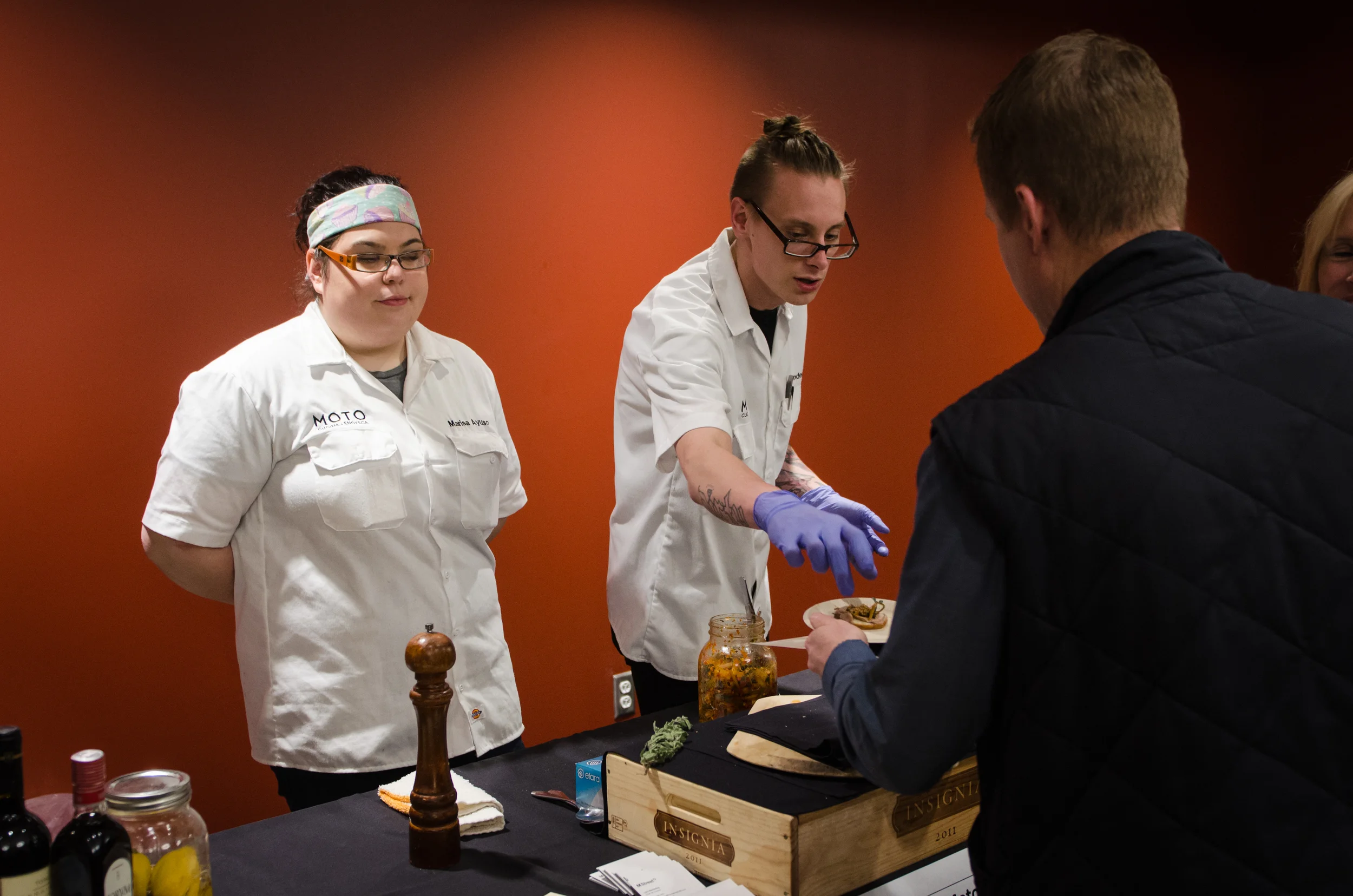 Moto's Chef Luke and Marisa interacting with VIP guests