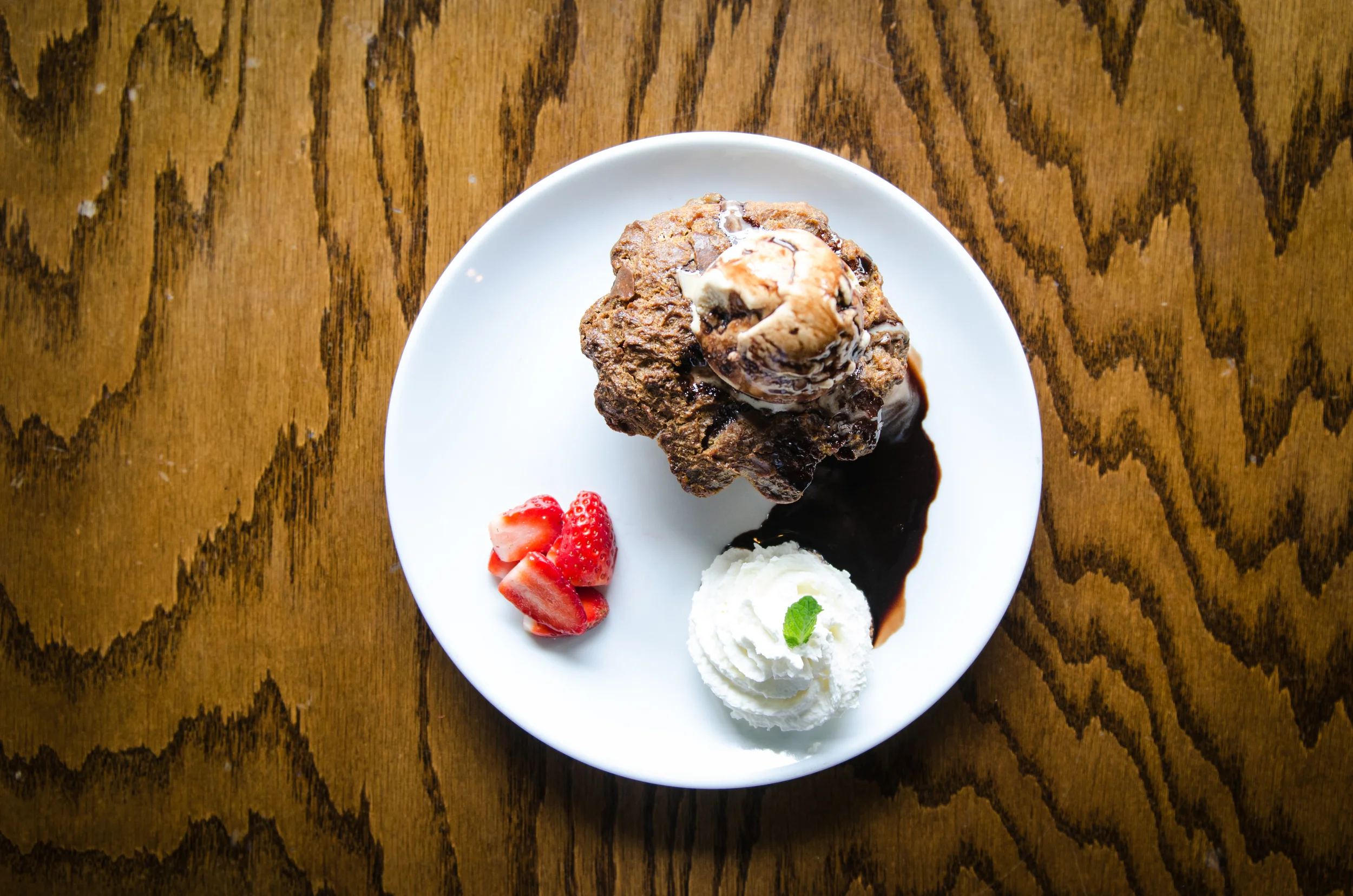 Whiskey Kitchen 's peanut butter banana bread pudding with cookie dough ice cream and Godiva chocolate sauce