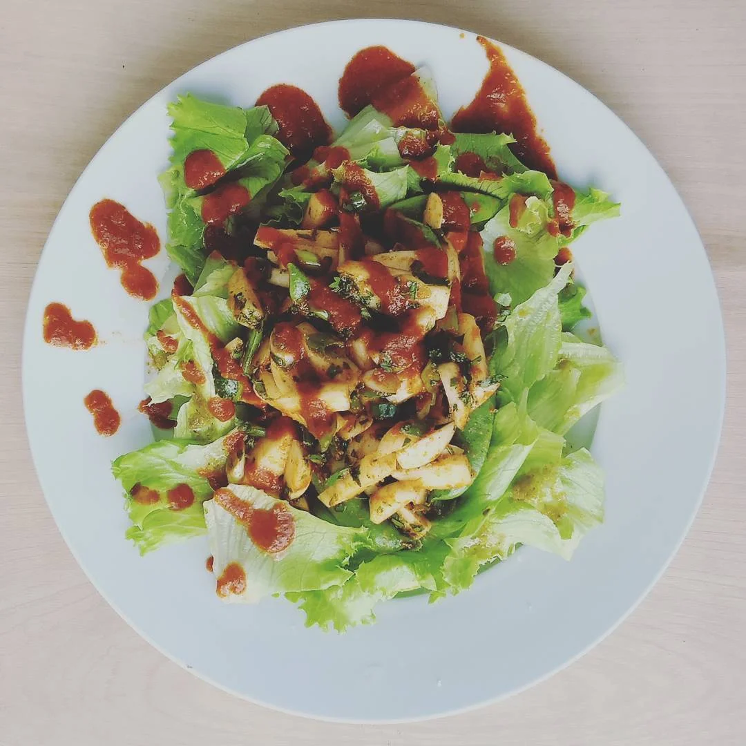 Shahiya Salad A bed of bib lettuce with green chutney and cilantro, turnip, snap pea salad dressed in olive oil and red chutney .