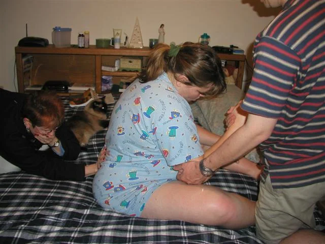 4:16amLots of back pain - Things are moving fast -My wonderful midwife applies counter-pressure to help me get through the contractions. She checks me and I'm 7cm - baby is really low and nicely lined up for birth.
