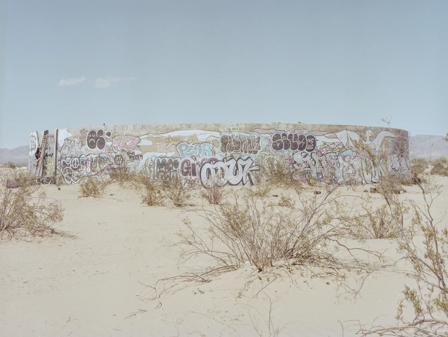 28 Aug 2016, Concrete Cylinder Structures with Grafitti, Slab City, NIland, CA. Pentax 645, Ektar 100 @ 400, Developed (Unicolor) and Scanned by me.