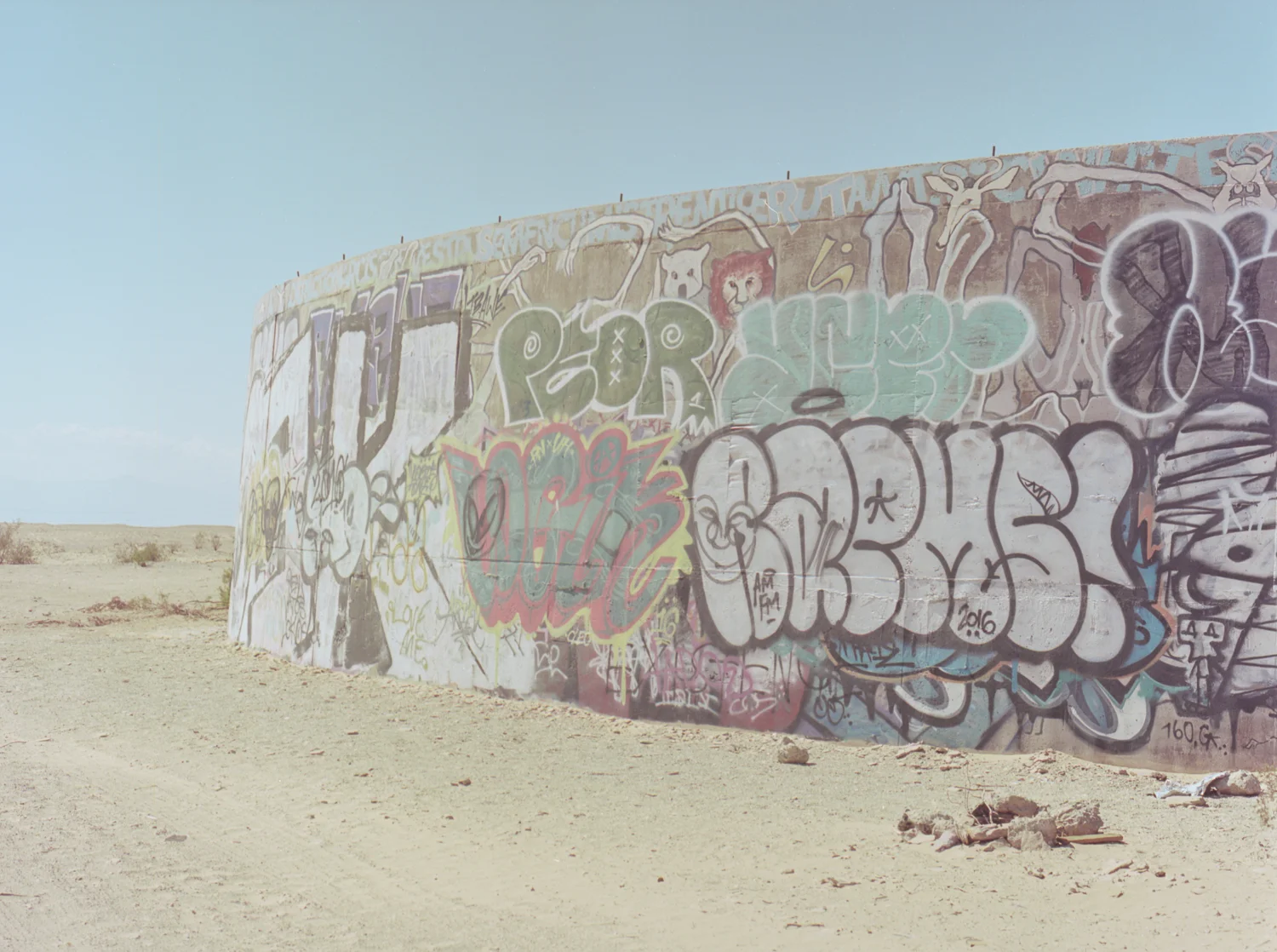 28 Aug 2016, Concrete Cylinder Structures with Grafitti, Slab City, NIland, CA. Pentax 645, Ektar 100 @ 400, Developed (Unicolor) and Scanned by me.