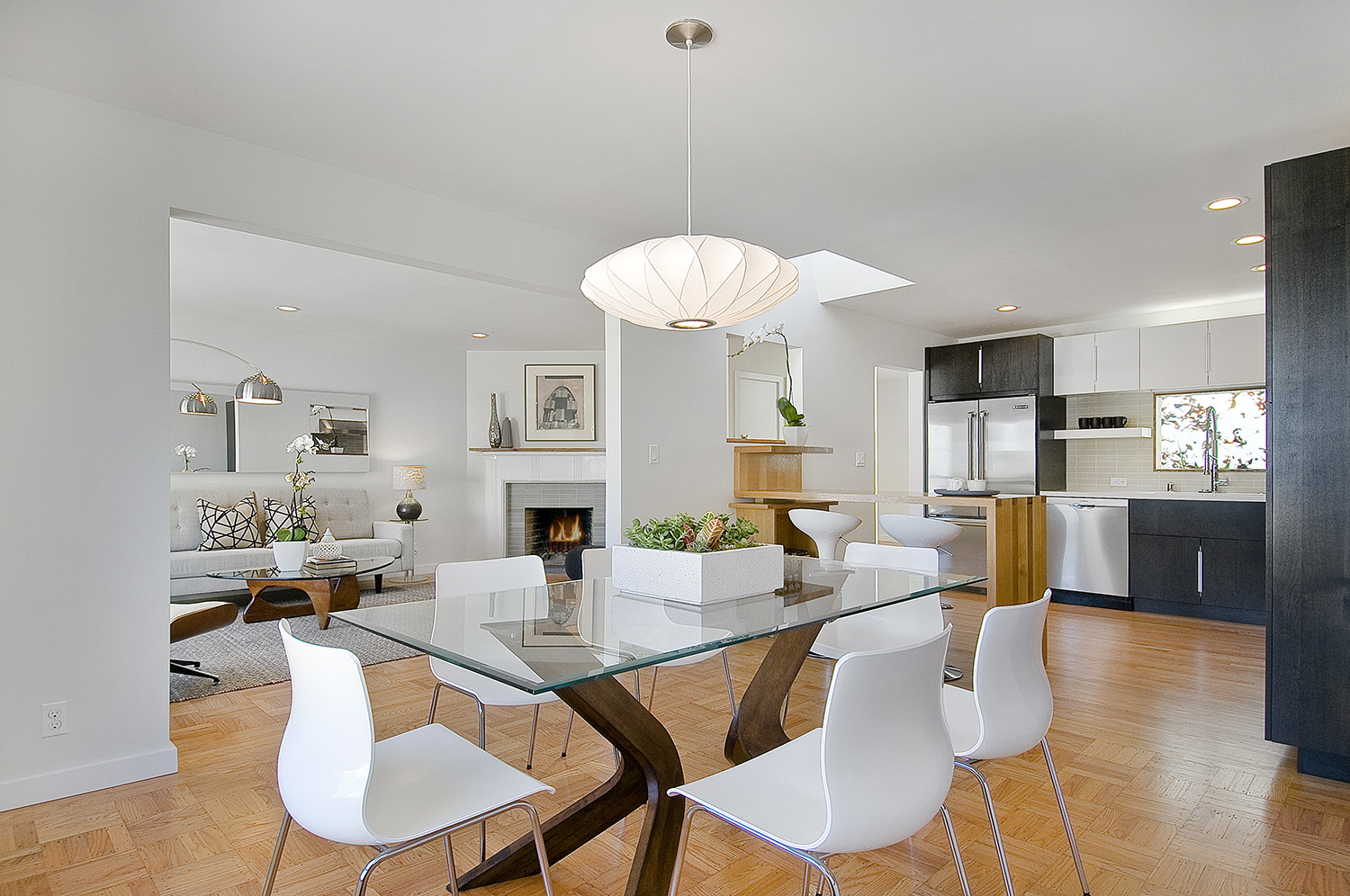To create a more connected feel the walls surrounding the kitchen were opened to the living/dining areas. 