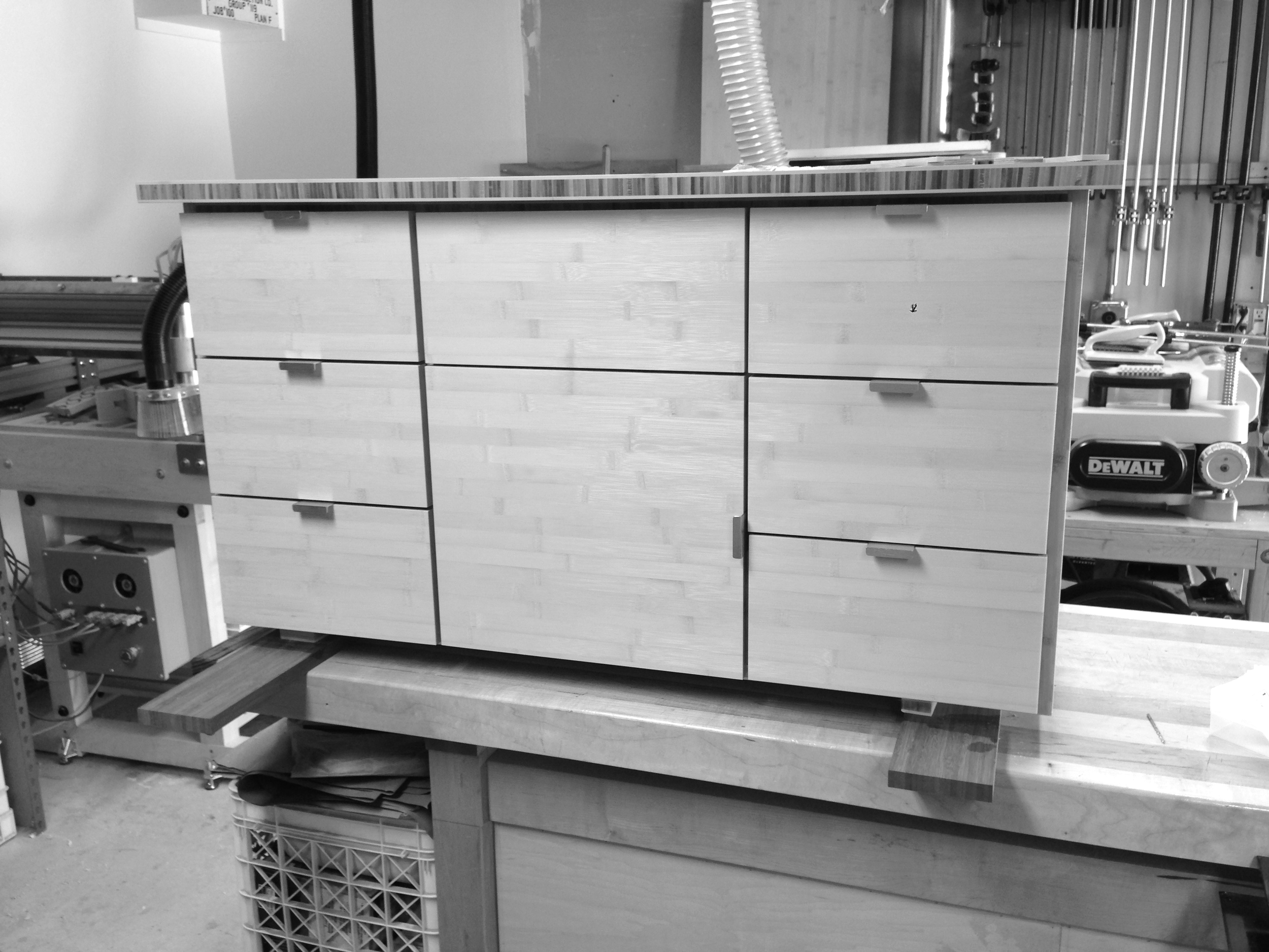To tie together the master bedroom's ensuite bathroom, the same 'natural flat grain' bamboo was used for the custom vanity. The drawer fronts were cut from the same sheet of 3/4" bamboo ply to create a harmonious look.