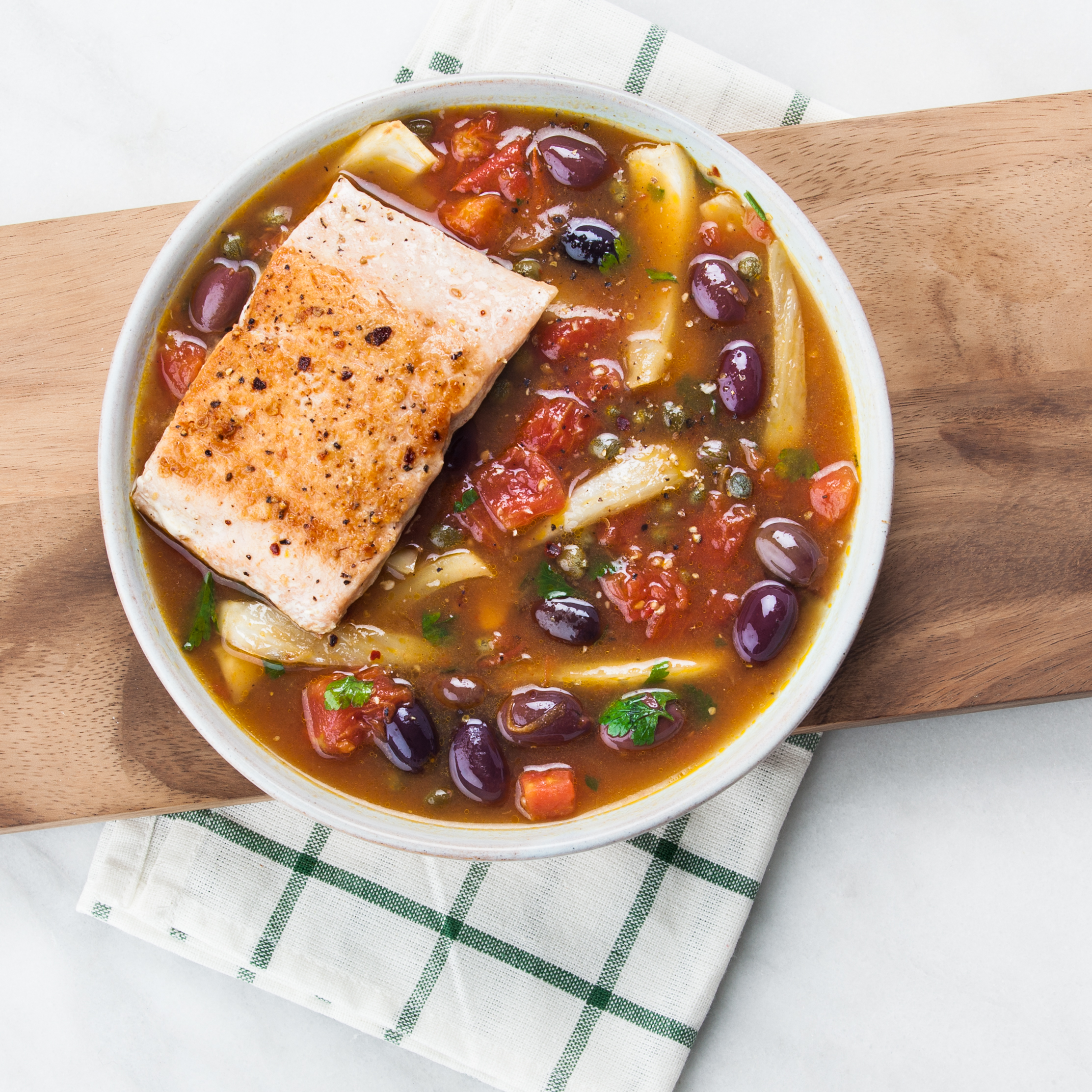 Pan-seared salmon with fennel, capers, and olives