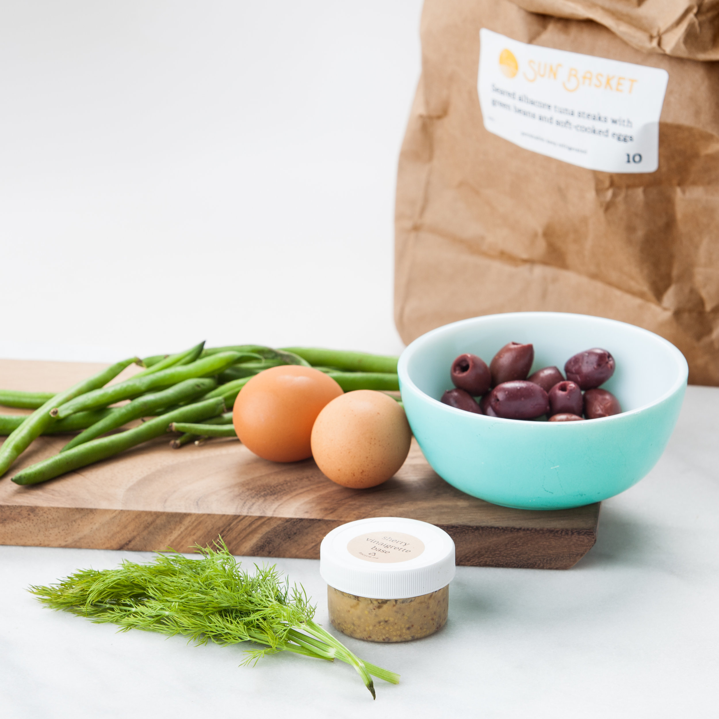 Seared albacore tuna steaks with green beans and soft-cooked eggs