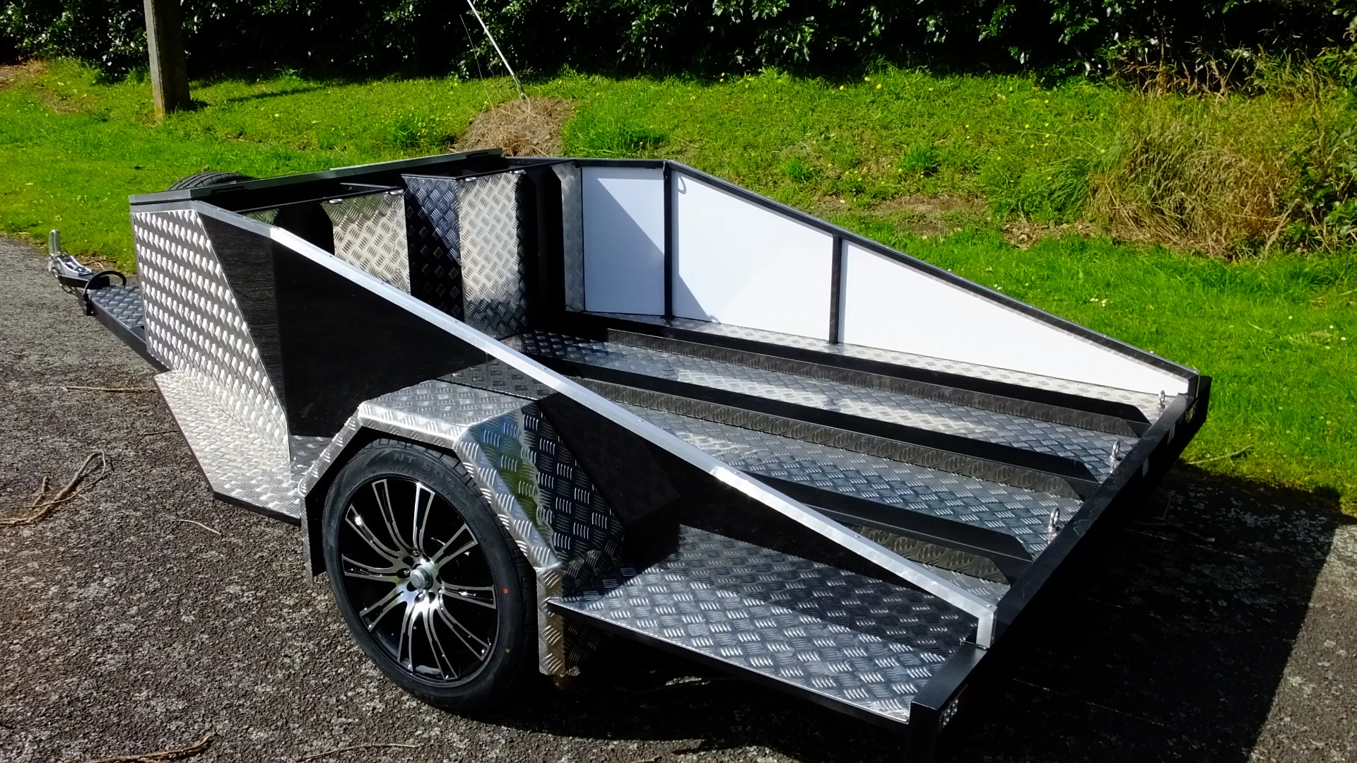 MStar 'Swift' Trailer: &nbsp;&nbsp;Channels for three full sized bikes, massive lockable storage area up front, &nbsp;twin open-top storage bays in front of the outside bikes, 17'" Alloys (incl spare!), Jockey Wheel, LED lights, ACM, Treadplate... Awesome!