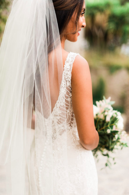Ishra, decided on our fitted Ivory Chantilly Lace Rosa Clara Acuraio gown with light beading around the bodice and sheer delicate detailing on the open back. Her gown couldn’t suit this Romantic venue more.