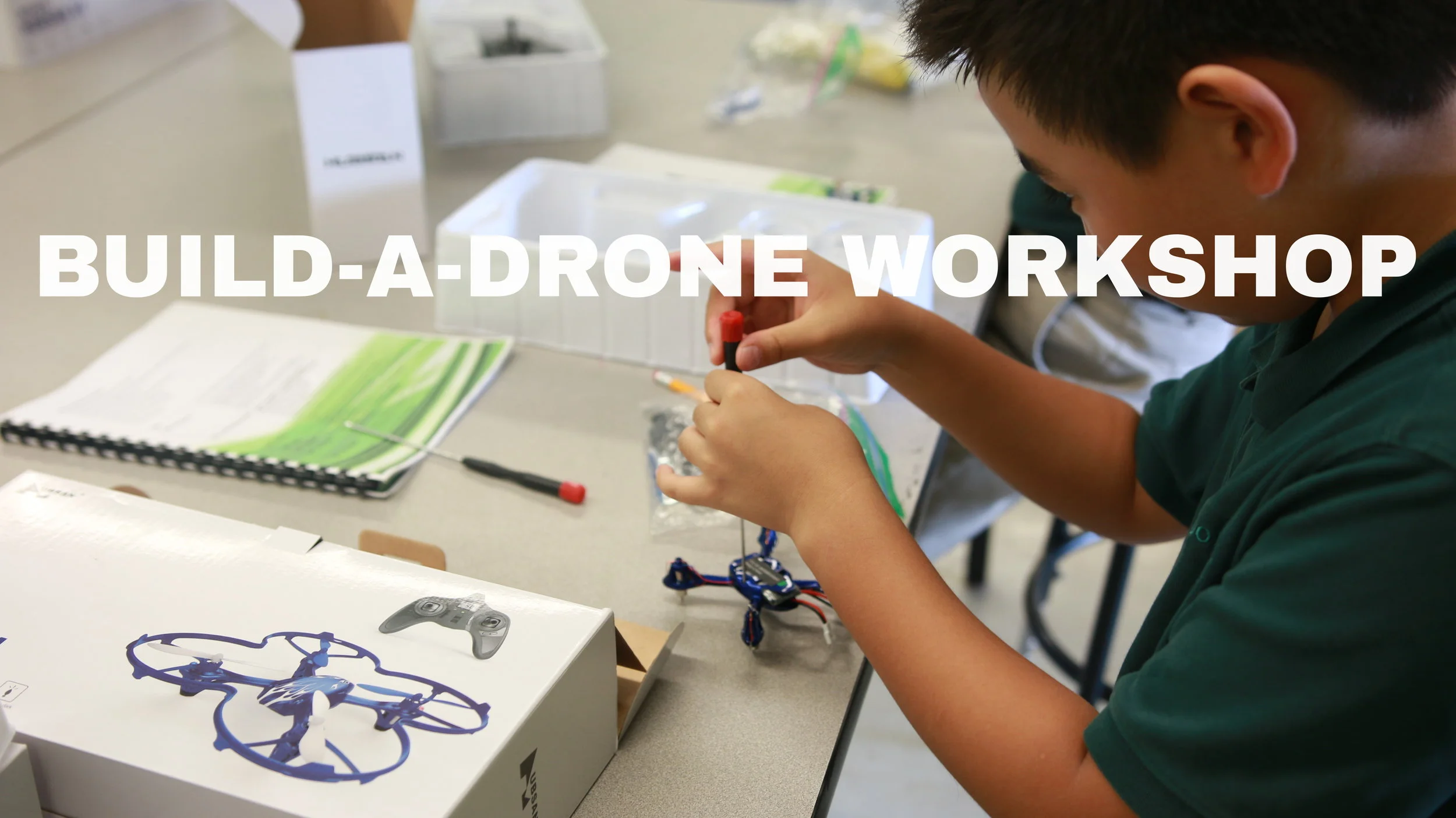 Still shot of Build a Drone workshop and STEM Camp hosted by Global Air Media. School kids put drones together in afterschool program.