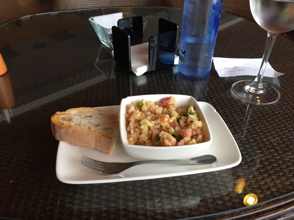 Complimentary Spanish rice with ham at this bar.