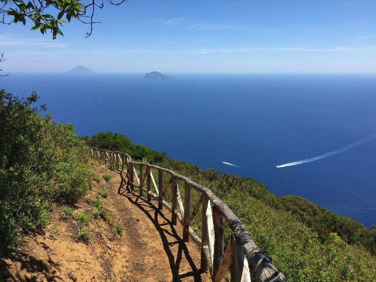 Saturday, June 27 Salina to Lipari
After getting up in the morning I went for another run up the local mountain, Monte Fossa delle Felci, 962 metres above sea level. It was a much more challenging route than I anticipated. It was so steep I couldn’t run up all the way, but had to hike for most of it. I found the trail head on the northwest part of town and made it up in about an hour. Around the same time I got to the top a nice group of people from Venice arrived via another route from the west. Our conversation was very basic as it was all in Italian (I’m getting better!) To get back down the mountain I opted for a trail to the south that took me past the village of Lingua and it offered much nicer views of the surrounding area than on the way up.
We left Santa Marina Salina in the afternoon and headed south for the island of Lipari. It’s the most populated of the Aeolian islands, I think around 10,000 inhabitants. A little while after our arrival I walked into town, got a few groceries we needed, and eventually came back to the boat and made dinner for us tonight. We had olives, sun-dried tomatoes, and bread as an appetizer, then tagliatelle with a nice tomato sauce I made. I had also picked up some fresh cherries from a vendor in town for our dessert. After our late dinner I walked into town and roamed around the bustling streets before retiring to bed around midnight.