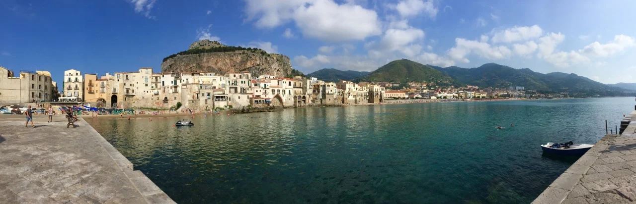 Thursday, June 25 San Nicola l'Arena to Cefalu
Here in Cefalu I’ve finally been able to get caught up on my blog, thanks to a steady Internet connection and the time to sit down and write and sort photos. Though it’s quite touristy here, it’s a nice town.
After we arrived and got settled I was keen to go swimming. Walking towards town I saw a place where some other people were bathing on the rocks. The water felt cool on my feet at first but after plunging into the the deep, clear blue water it was so refreshing! I’d wished I had brought along some goggles or a snorkel mask because it looked incredible. I went back to the boat for a shower and then wandered into town. I was really hungry so stopped at a place with wi-fi and opted to try their minestrone & pasta soup. It was delicious! I was able to write for a while and post some photos to my blog & Instagram before heading back to the boat for dinner with the others. Malcolm had made some really nice gnocchi which we ate with a pistachio-garlic olive oil dressing.
I walked back to town afterwards, back to the same café, and had some tea while I continued writing. The network connection lasted until just after midnight, when I was ready to head back anyway. Along the way I heard some live music ahead. I kept walking to where some students were playing guitar and singing “Zombie” by The Cranberries. I hung around to listen then chatted with them for a bit before continuing home to the boat. It was very pleasant to walk the streets so late at night as it was so quiet and peaceful. A nice finish to the day! Cefalu has been one of my favourite places so far.