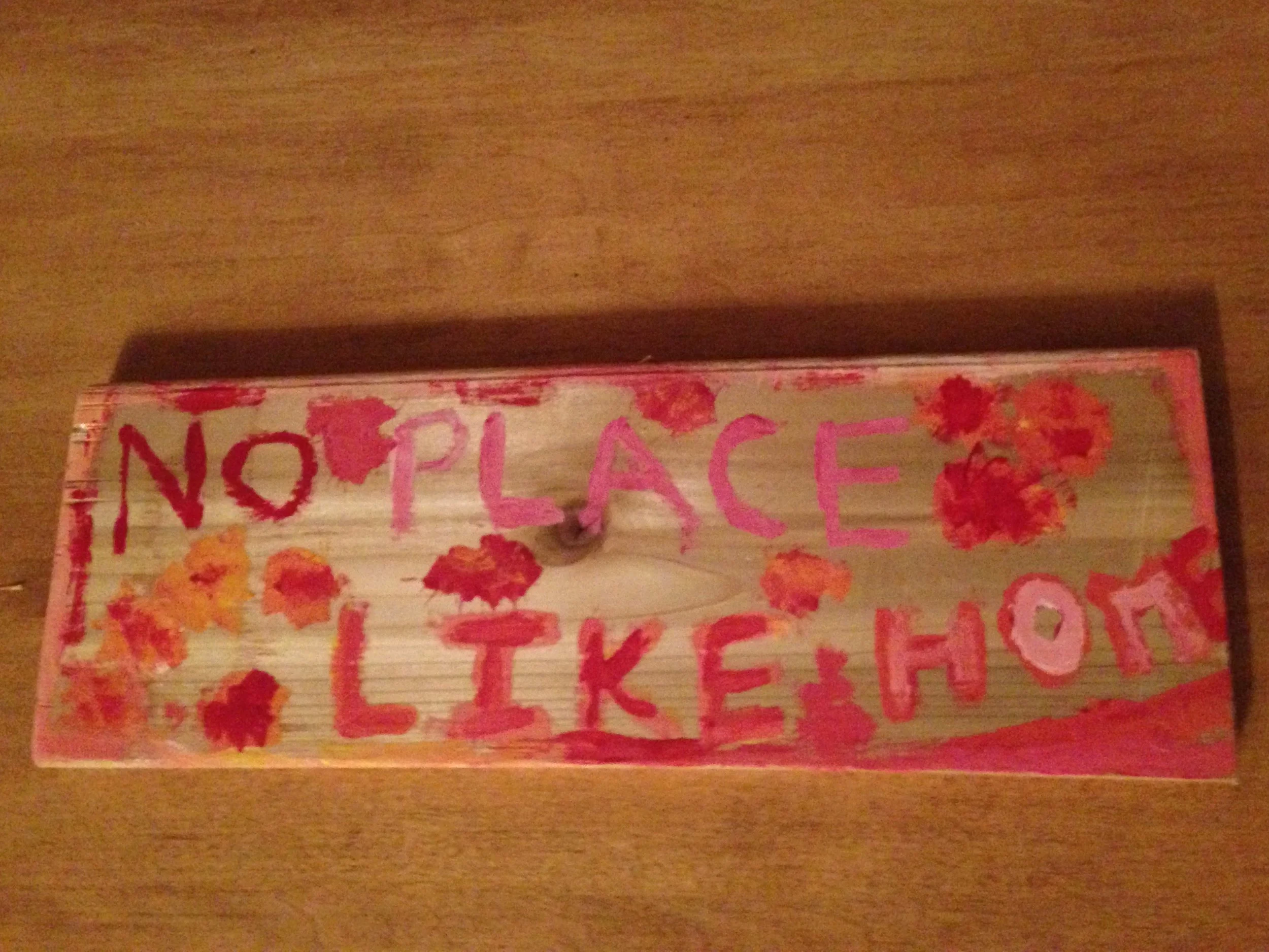 The “No Place Like Home” sign I painted for my mom.