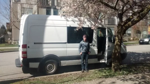 Eliza in front of her new camper van: a perfect vehicle for scouting locations for her second social venture.