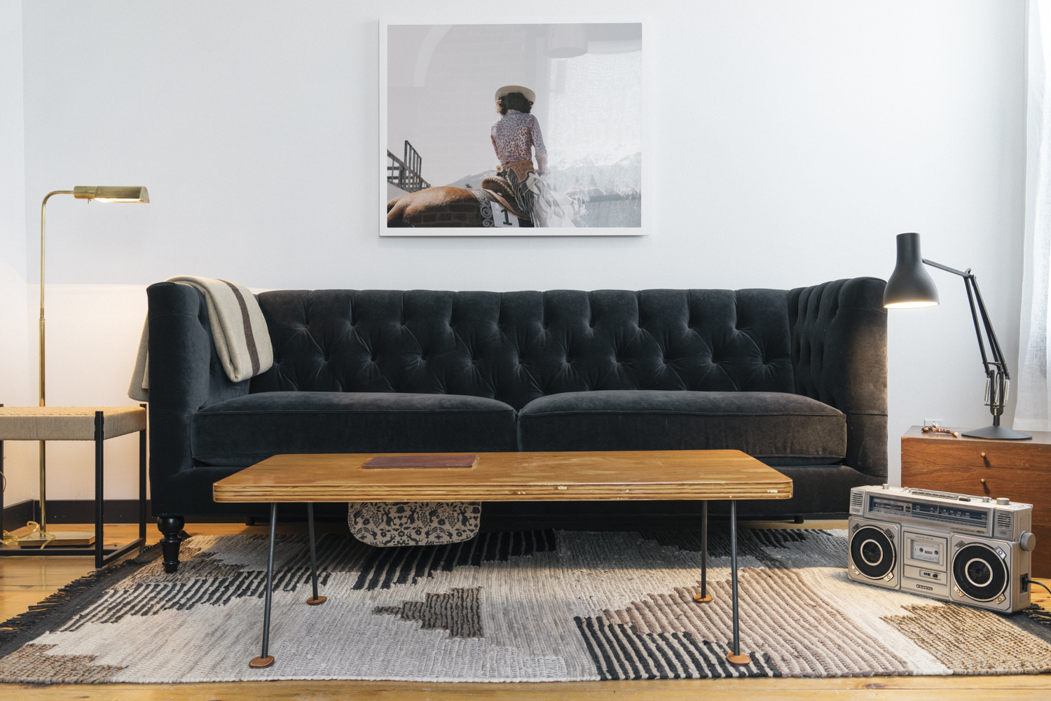 Next level relaxation vibes with a Belmont Tuxedo sofa from Rejuvenation , coffee table from M. Crow & Co and the boomboom box with epic tape collection