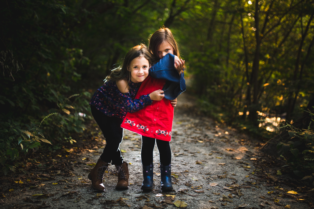 beautiful fall family photo kids on trail