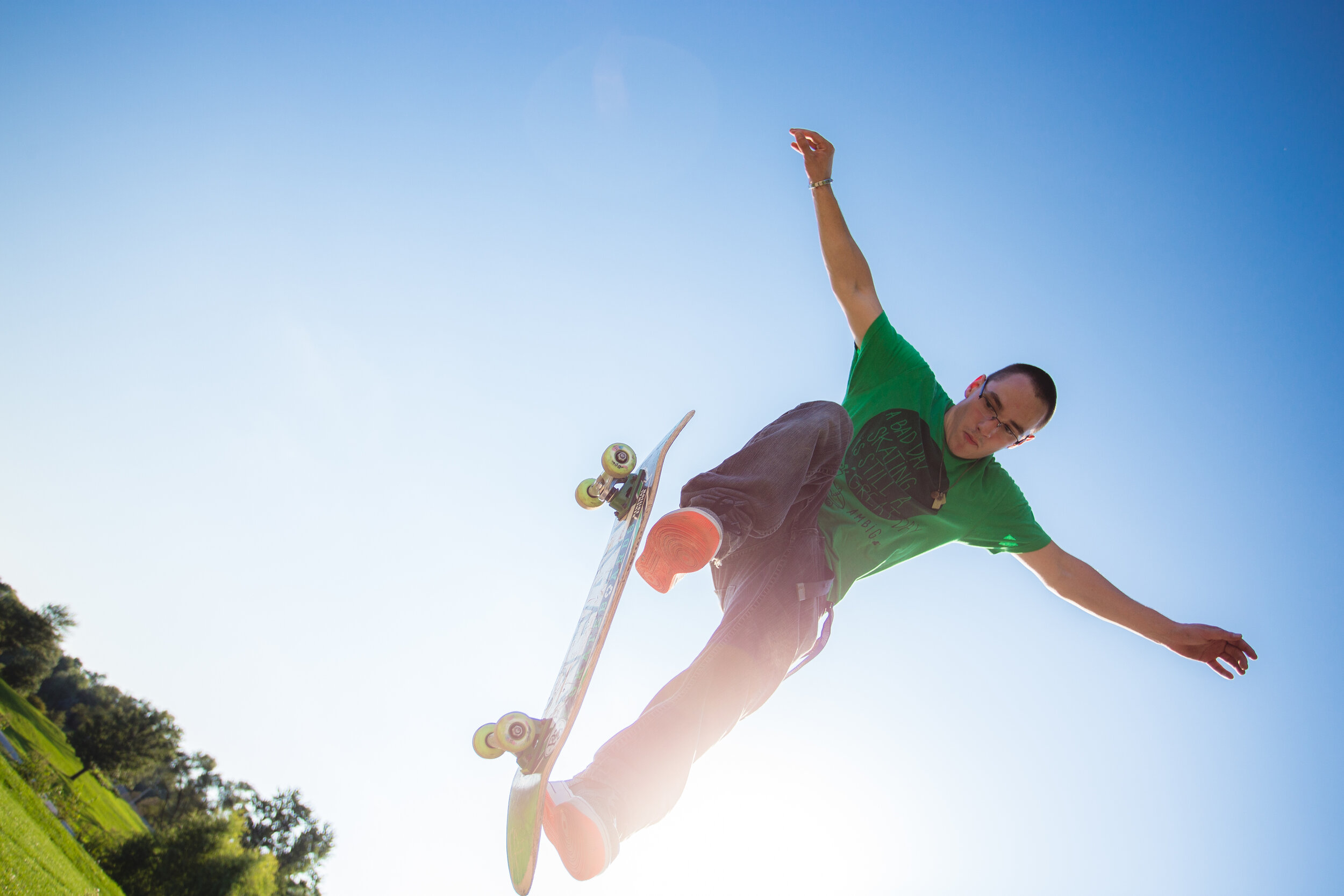 Omaha high school skateboarder jumping off a ramp