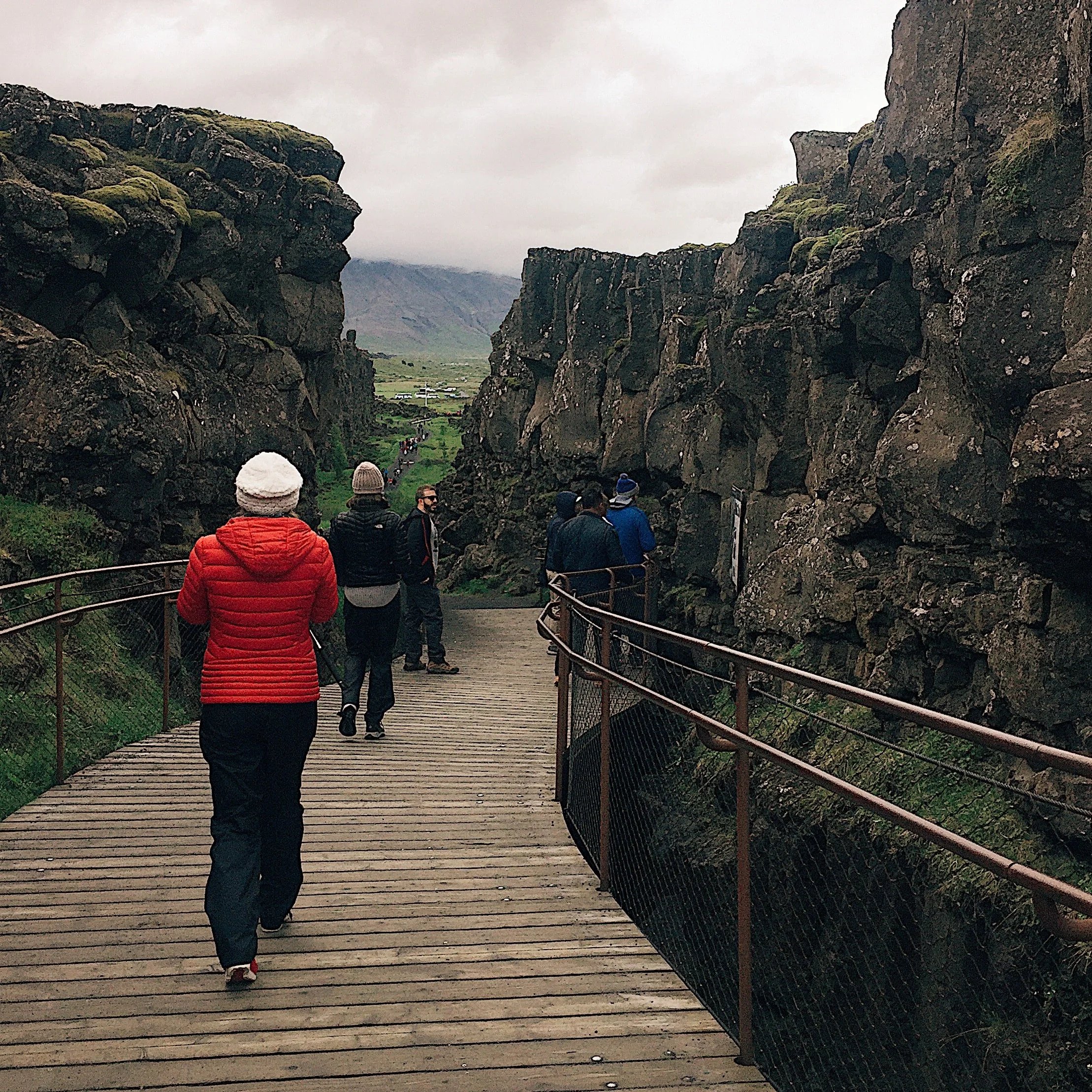 Two plates between us. Walking along the rift in the valley at Thingvellir.