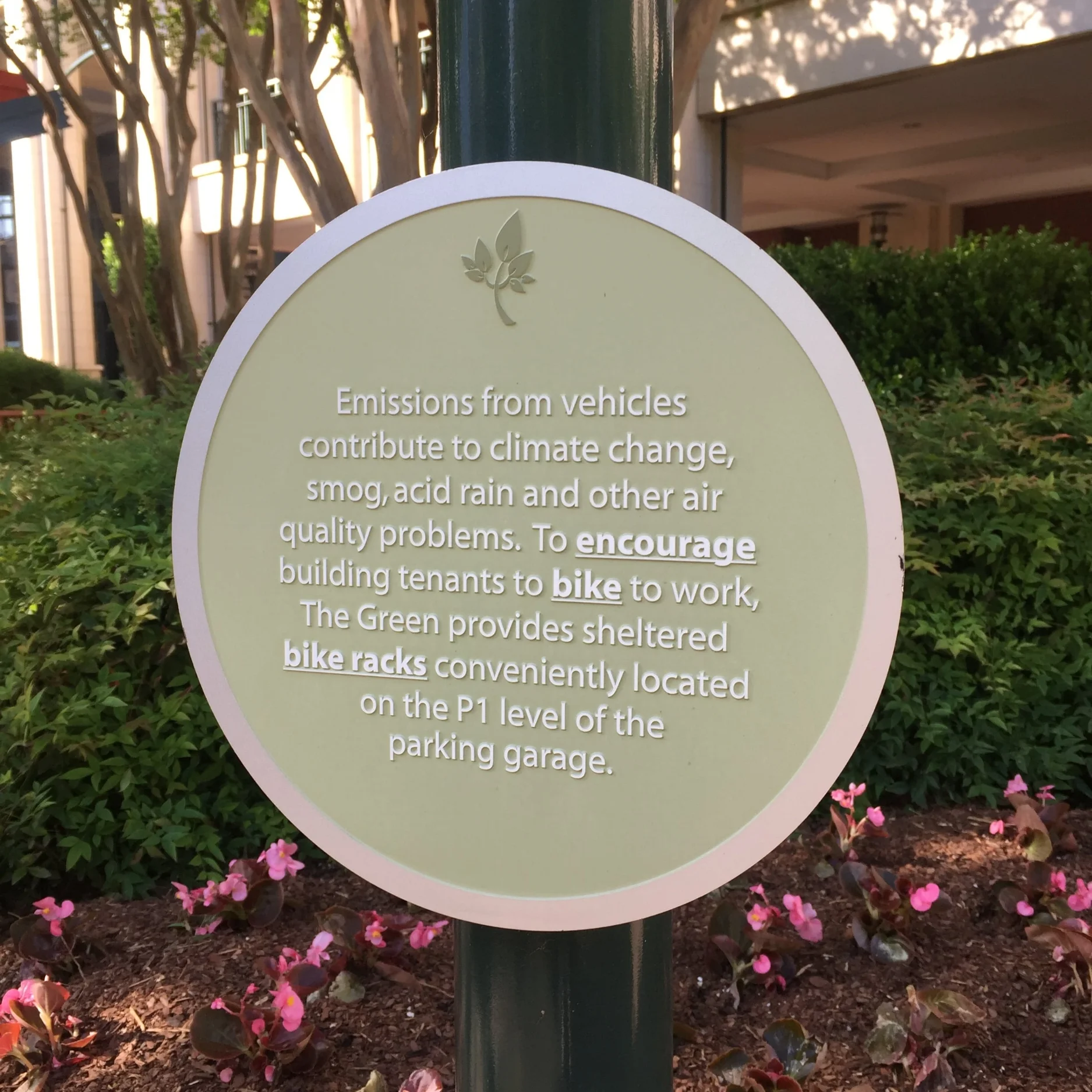 Charlotte sustainable signs on benefits of biking. 
