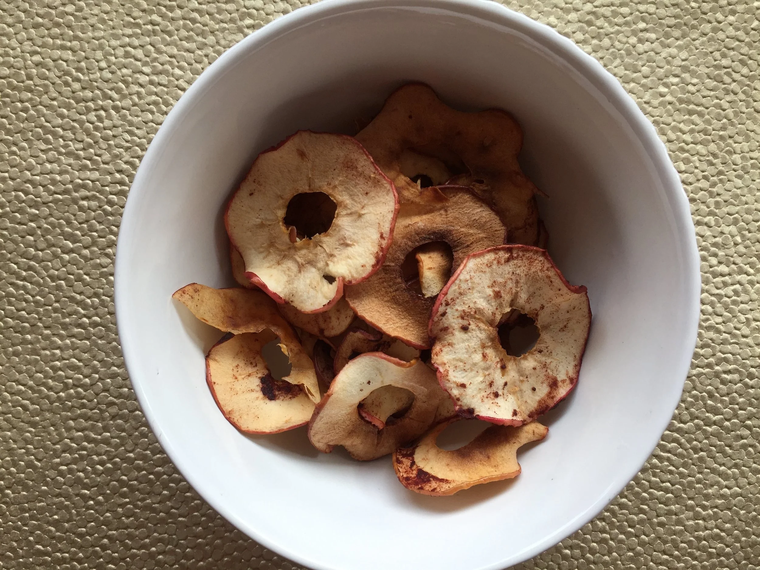 3 ingredient baked cinnamon apple chips. An easy, whole30, paleo and zero waste snack. AND, it makes your home smell wonderful!
