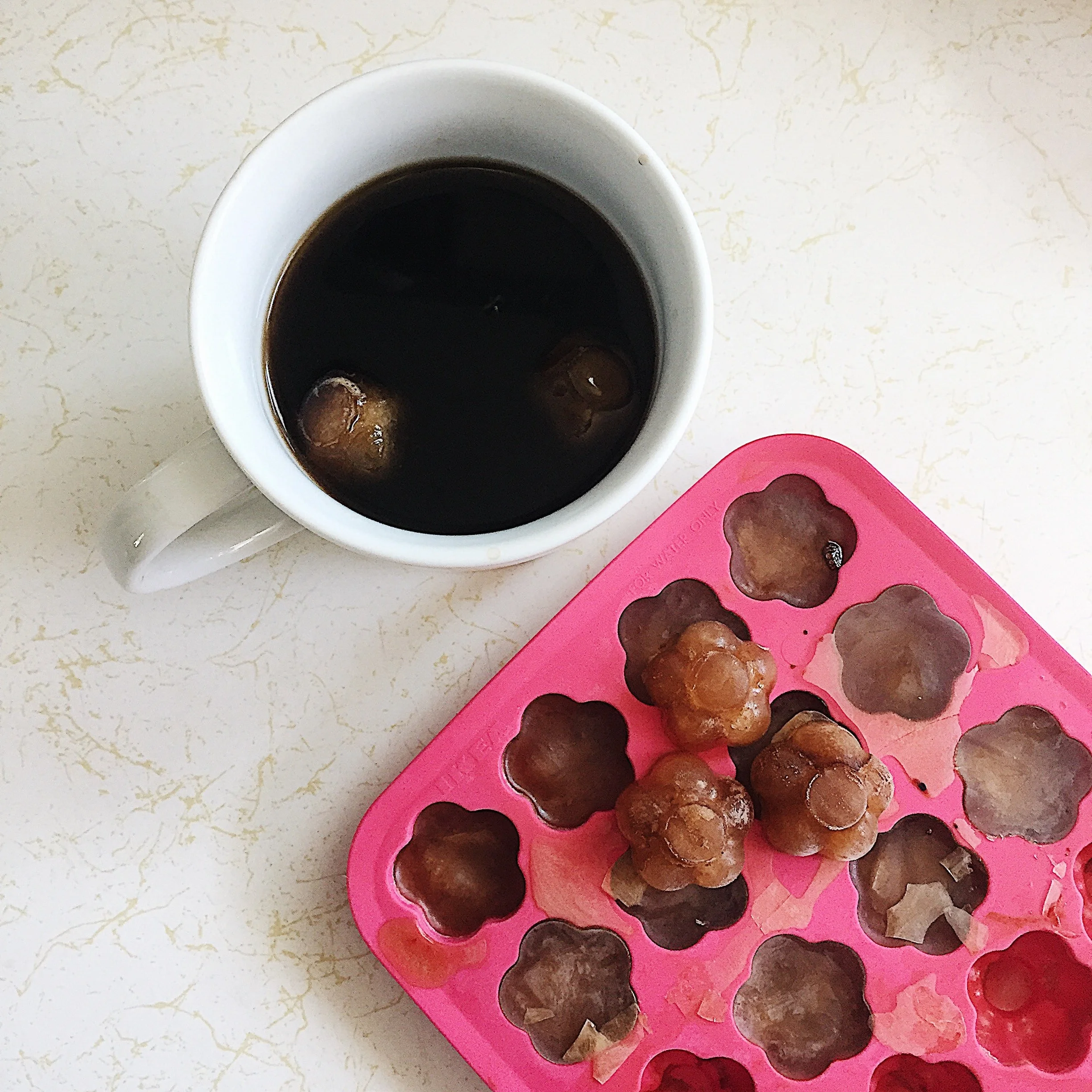 Freezing leftover coffee into ice cubes for later.