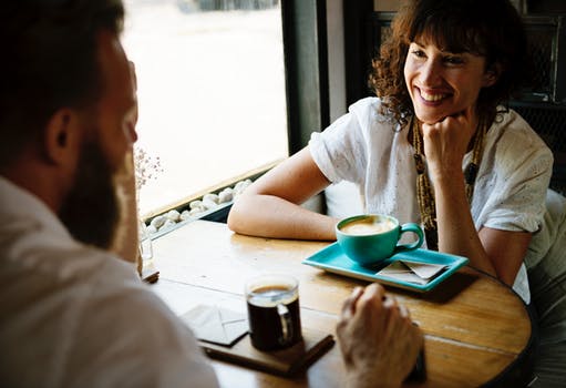 Man and woman talking in cafe.jpeg