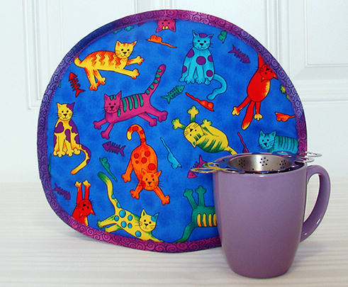 Tabard Cartoon Cats lavender mug 405x491.jpg