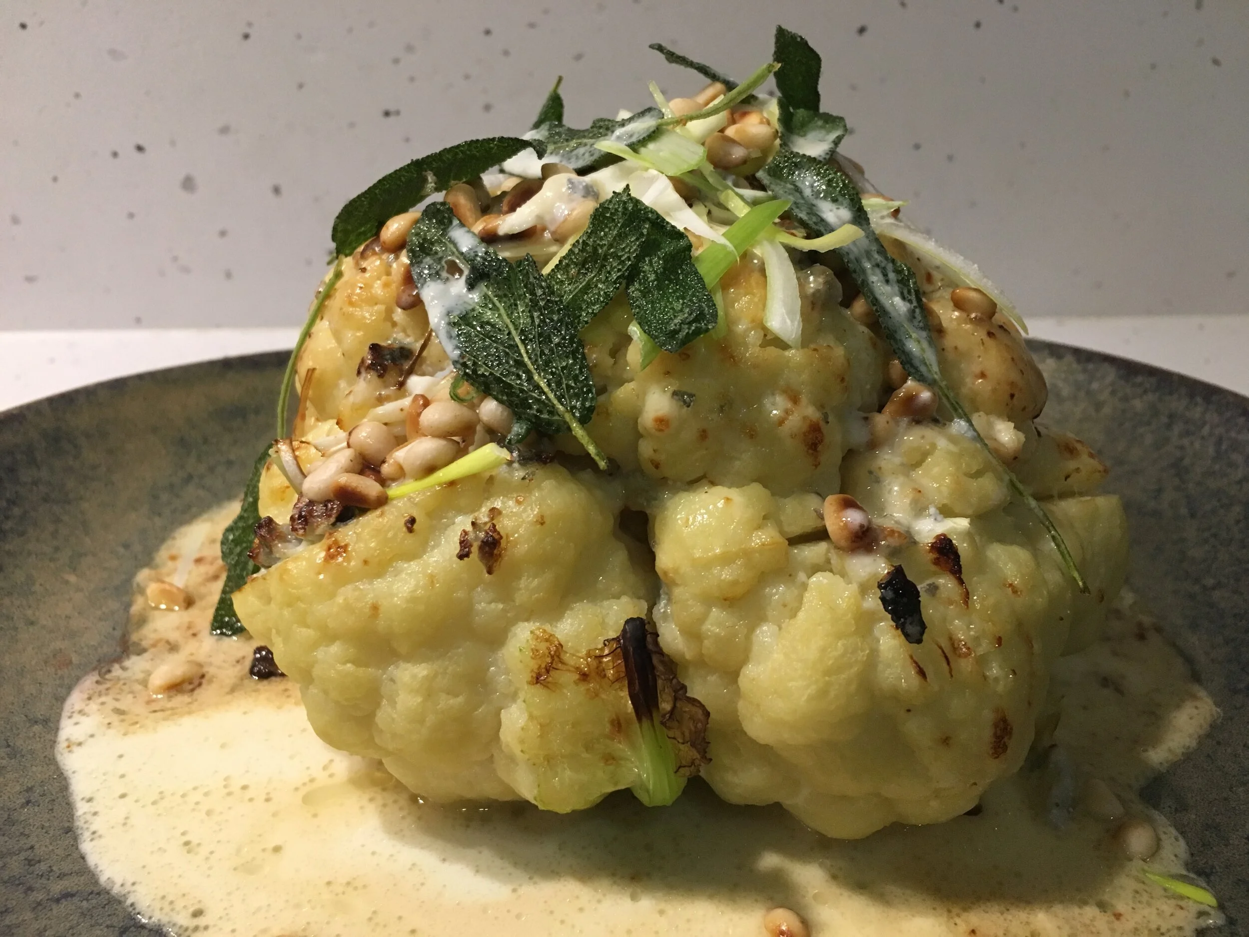 ROASTED CAULIFLOWER, BLUE CHEESE SAUCE, PINE NUTS AND SAGE