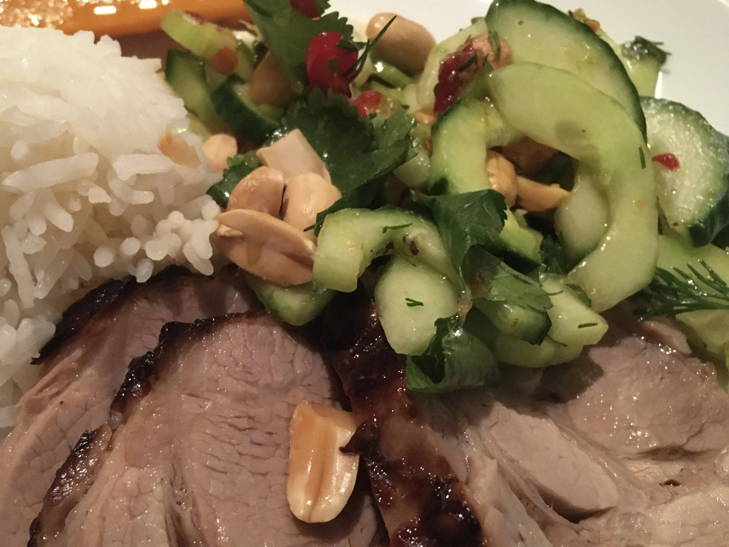 WARM ROASTED PORK WITH SPICY CUCUMBER AND PEANUT SALAD