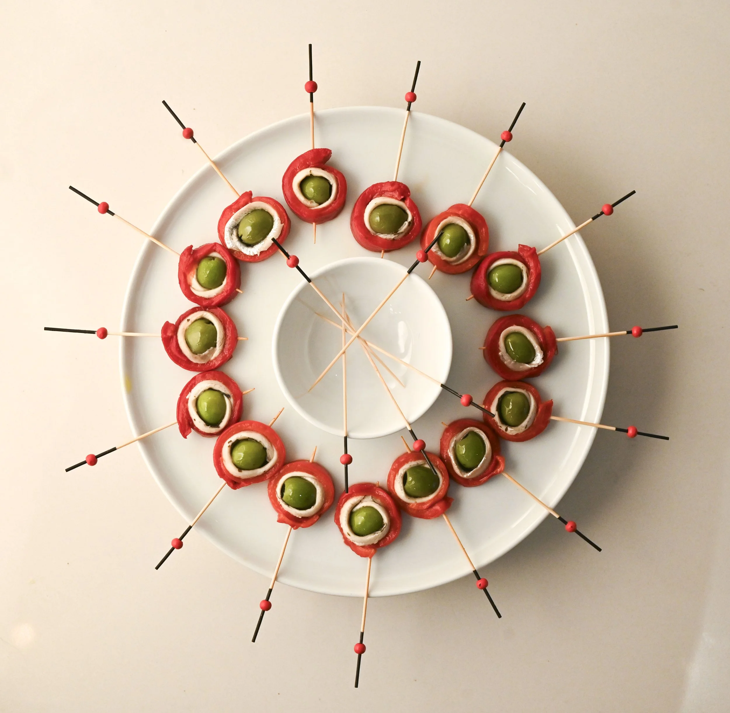 OLIVE, WHITE ANCHOVY AND ROASTED RED CAPSICUM PINWHEELS