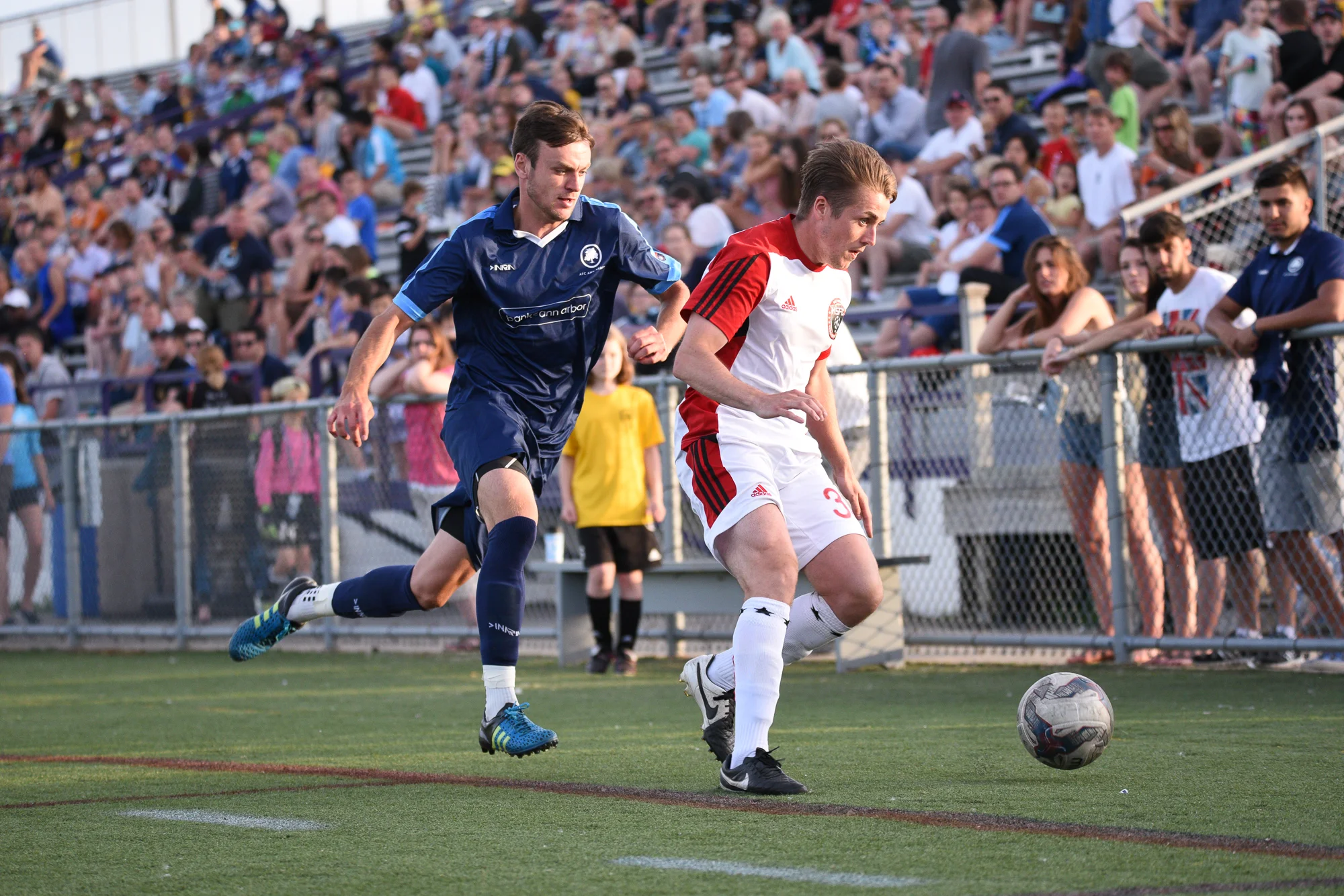 Vaughan challenges a Michigan Stars defender for possession, last year at Hollway Field
