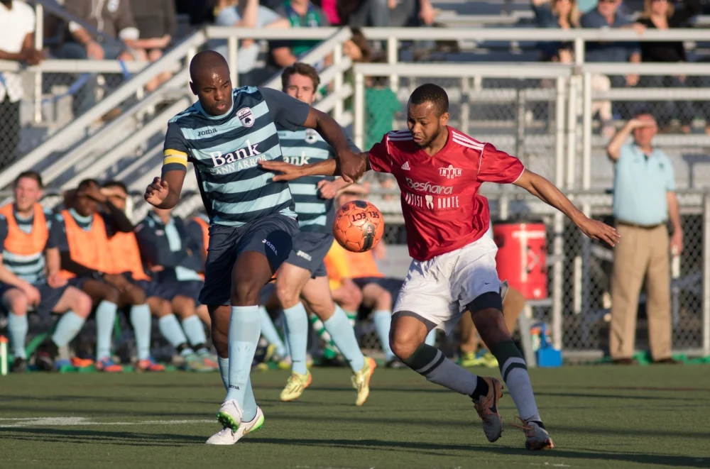 Knox Cameron looks to regain possession in The Mighty Oak's inaugural match in 2015