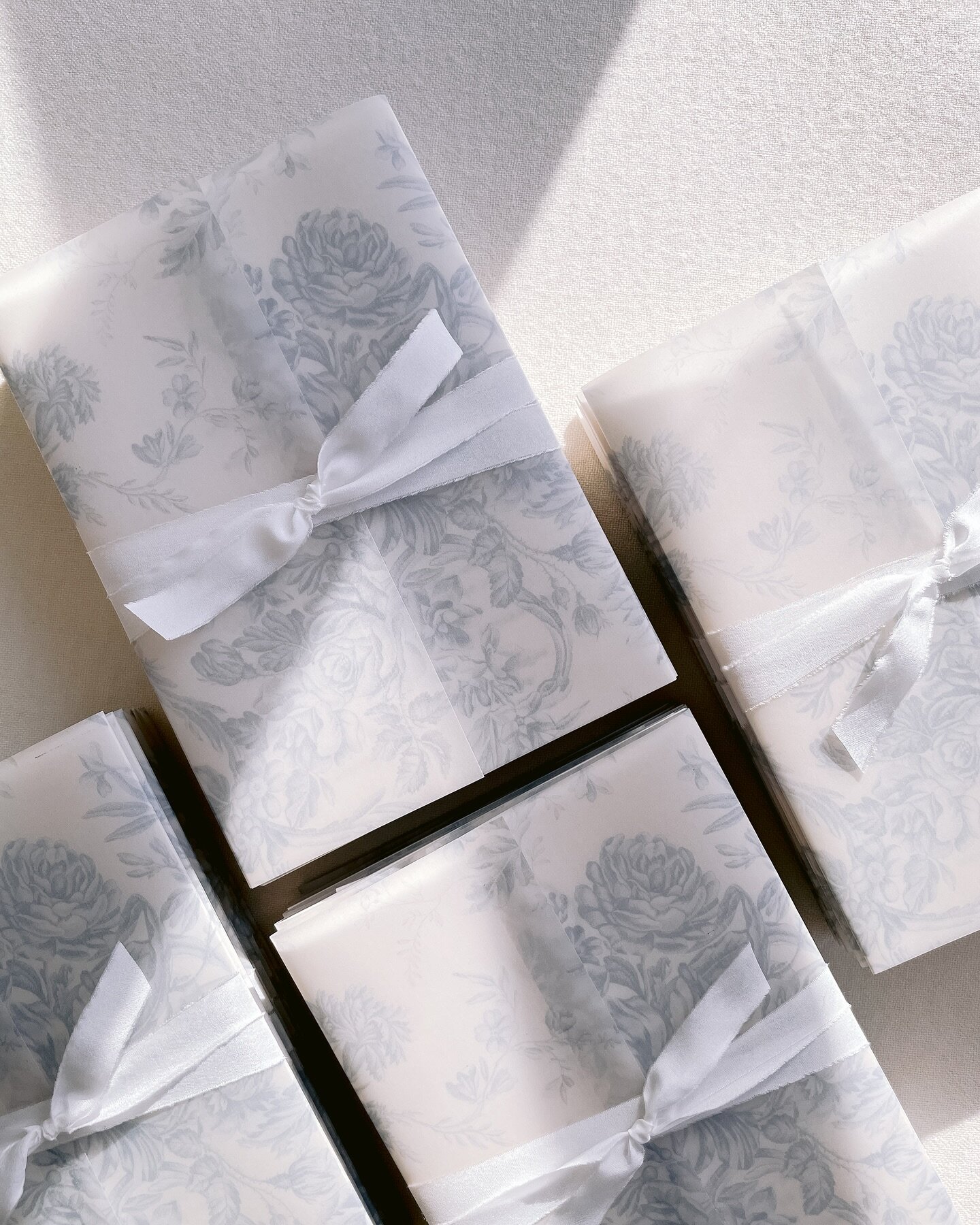 Pretty vellum and silk wrapped stacks for A&amp;J!