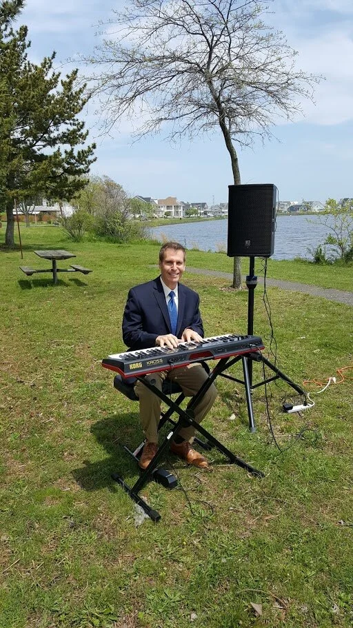 Arnie playing a wedding ceremony-outdoor.jpg