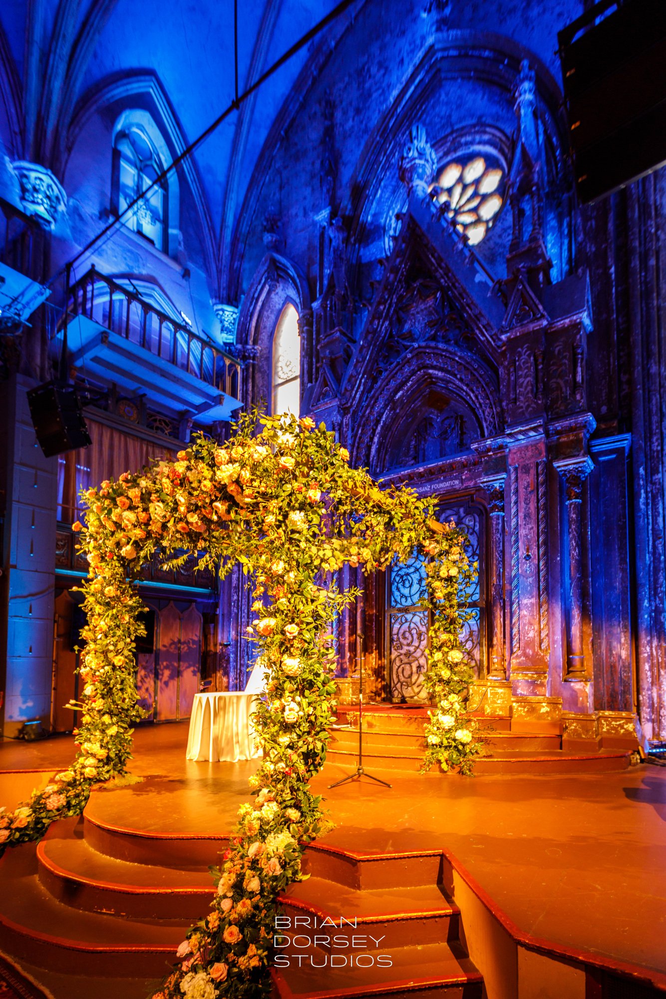 ceremony chuppah roses greenery orensanz.JPG